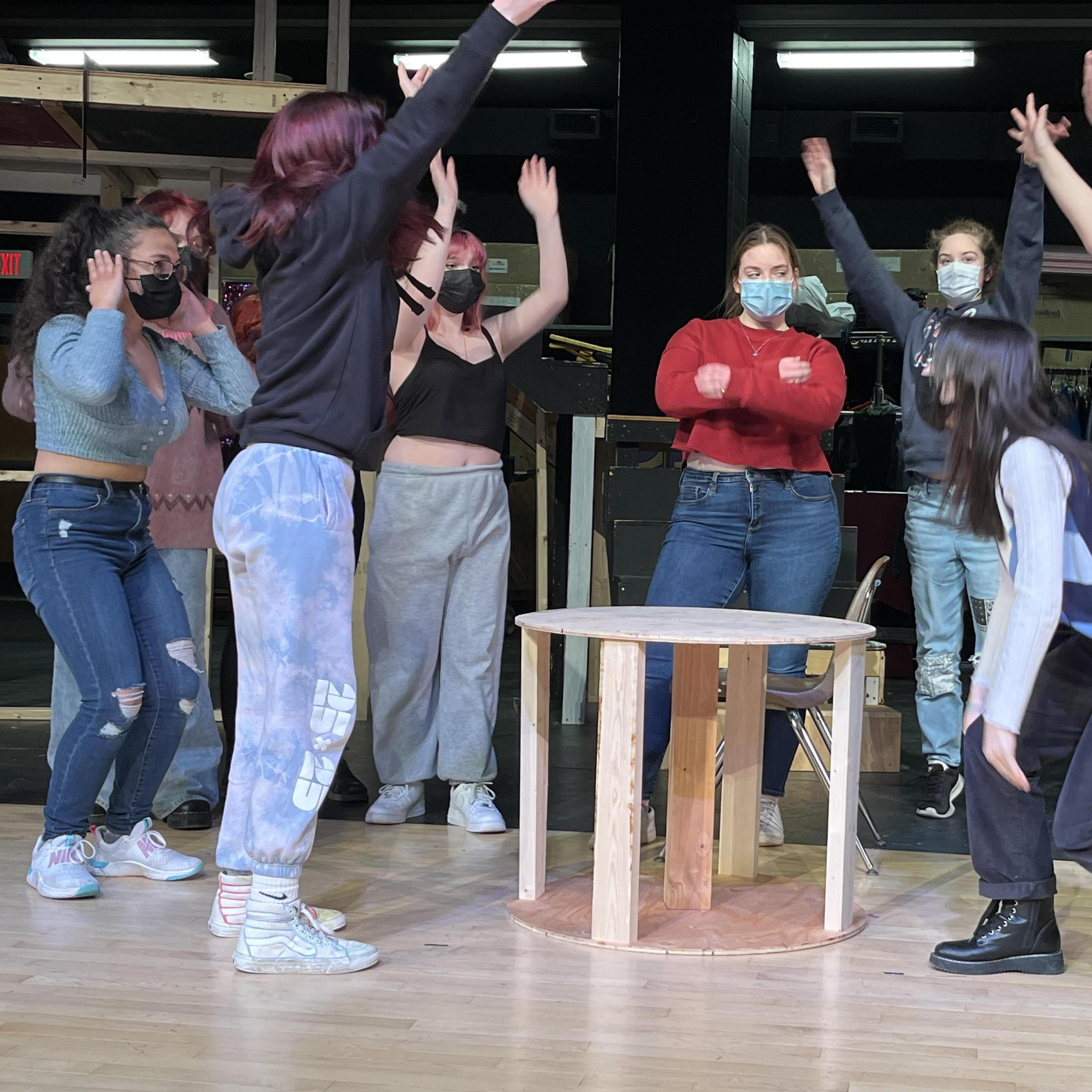 Emmalyse (Donna) rehearses "Money, Money, Money" with the chorus