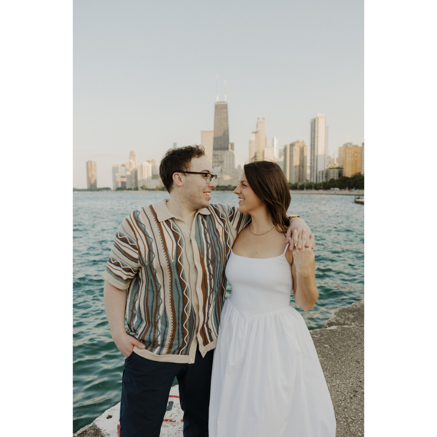 Engagement photo shoot on the lake front.