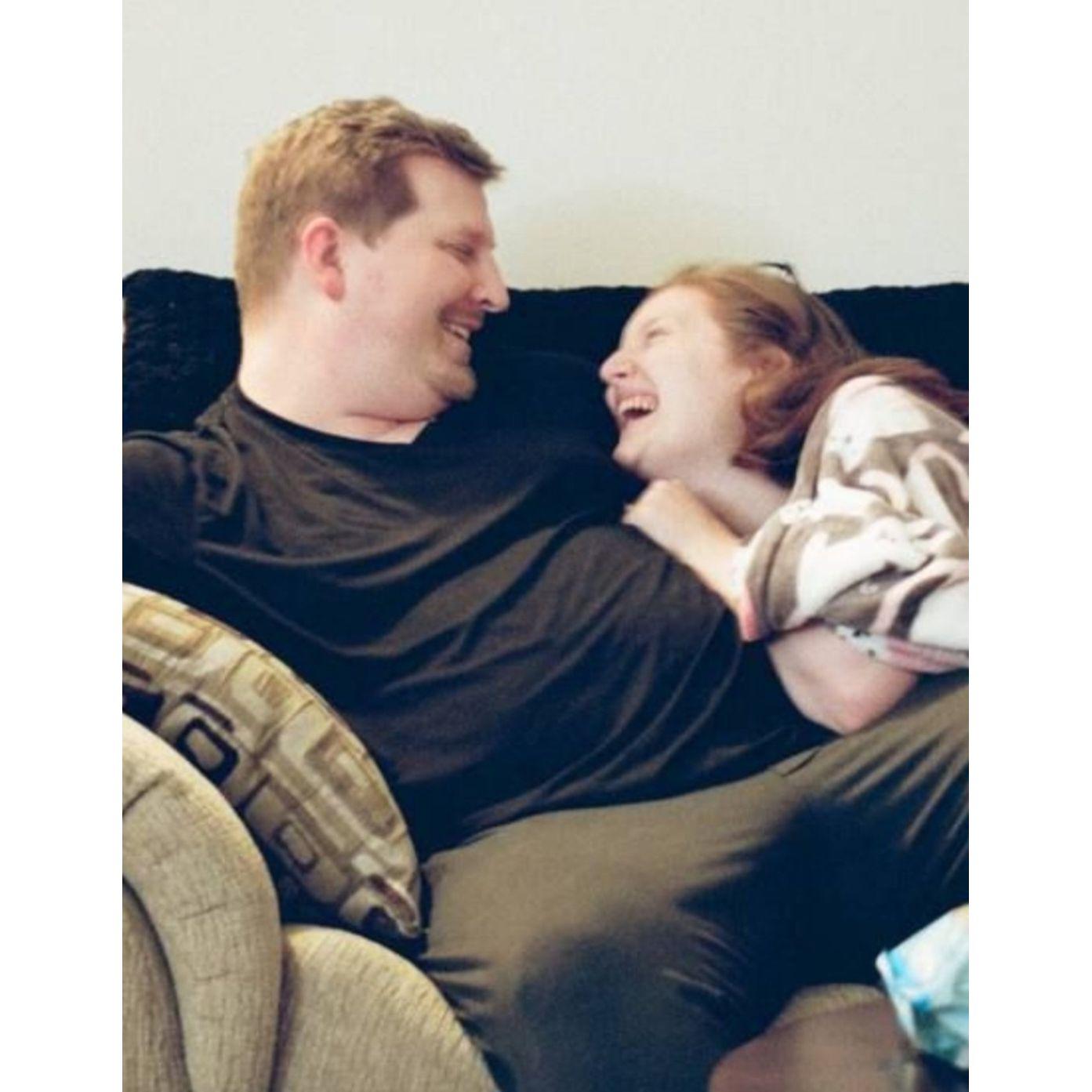 Rufat took a photo of us laughing on the couch in our Delmar Apartment