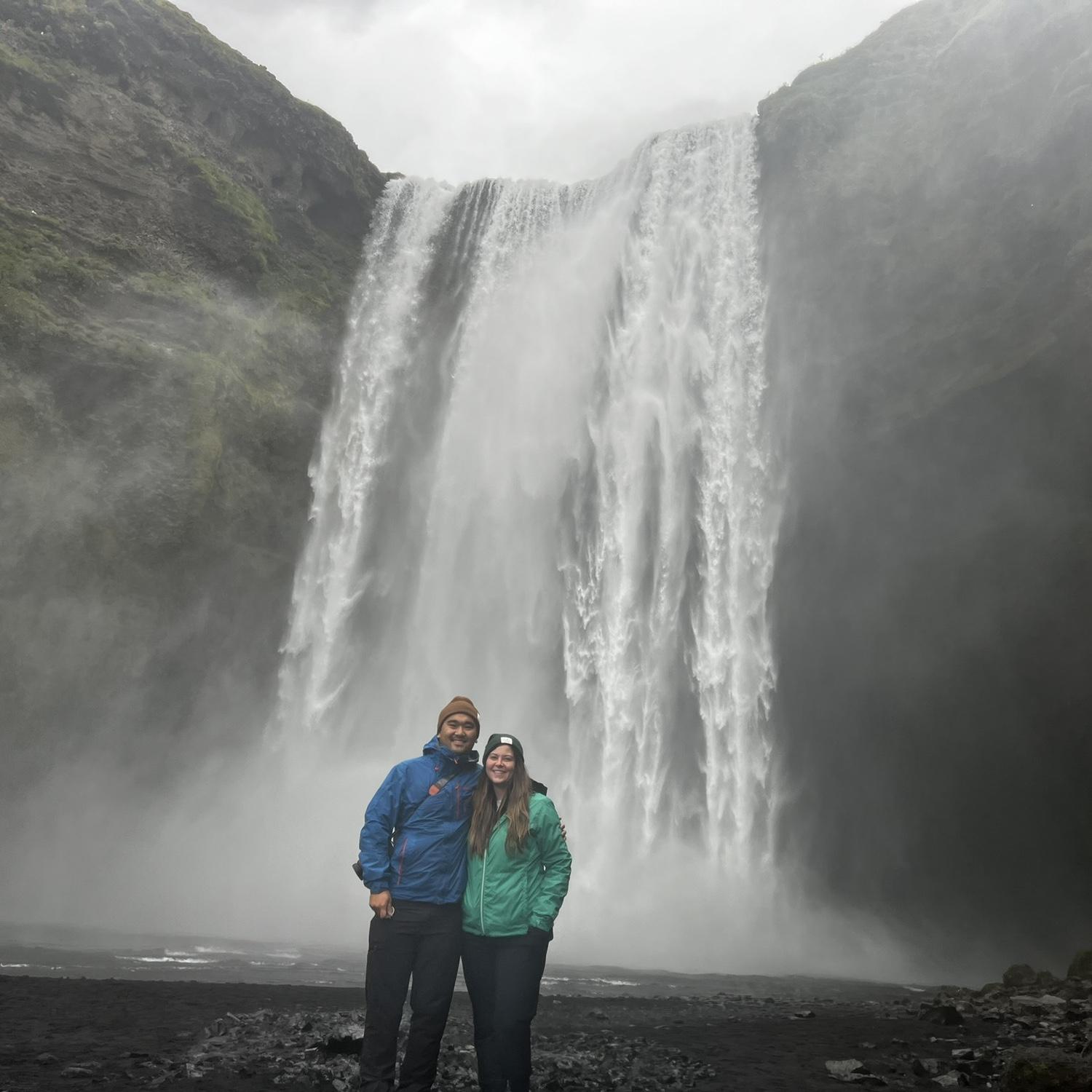 Skógafoss in Iceland... Jessica is hiding how cold she is well!
