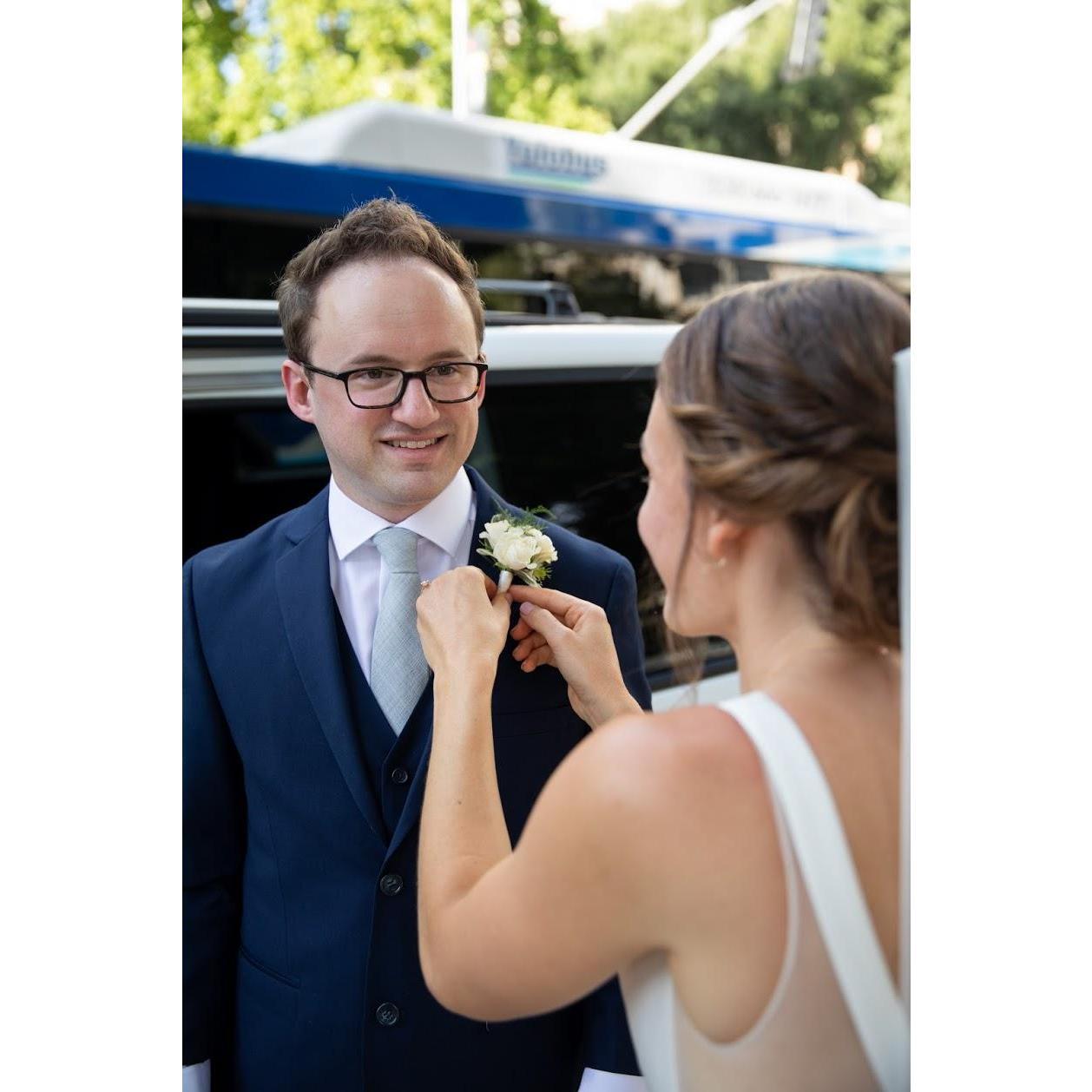 Rachel pinning Steve's boutonnière