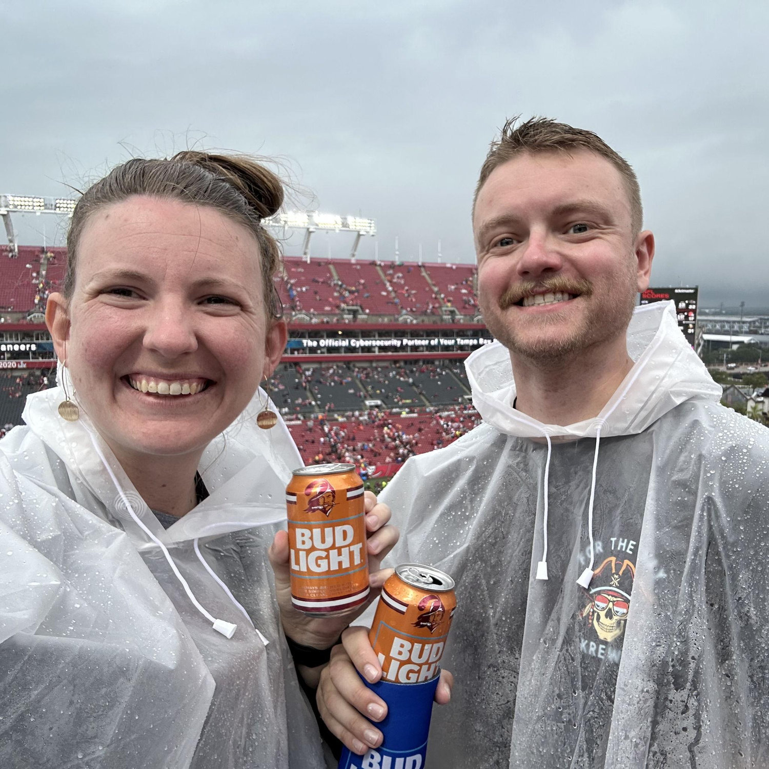 First NFL game. Officially Buccs fans. Downpour of rain. Free beer.