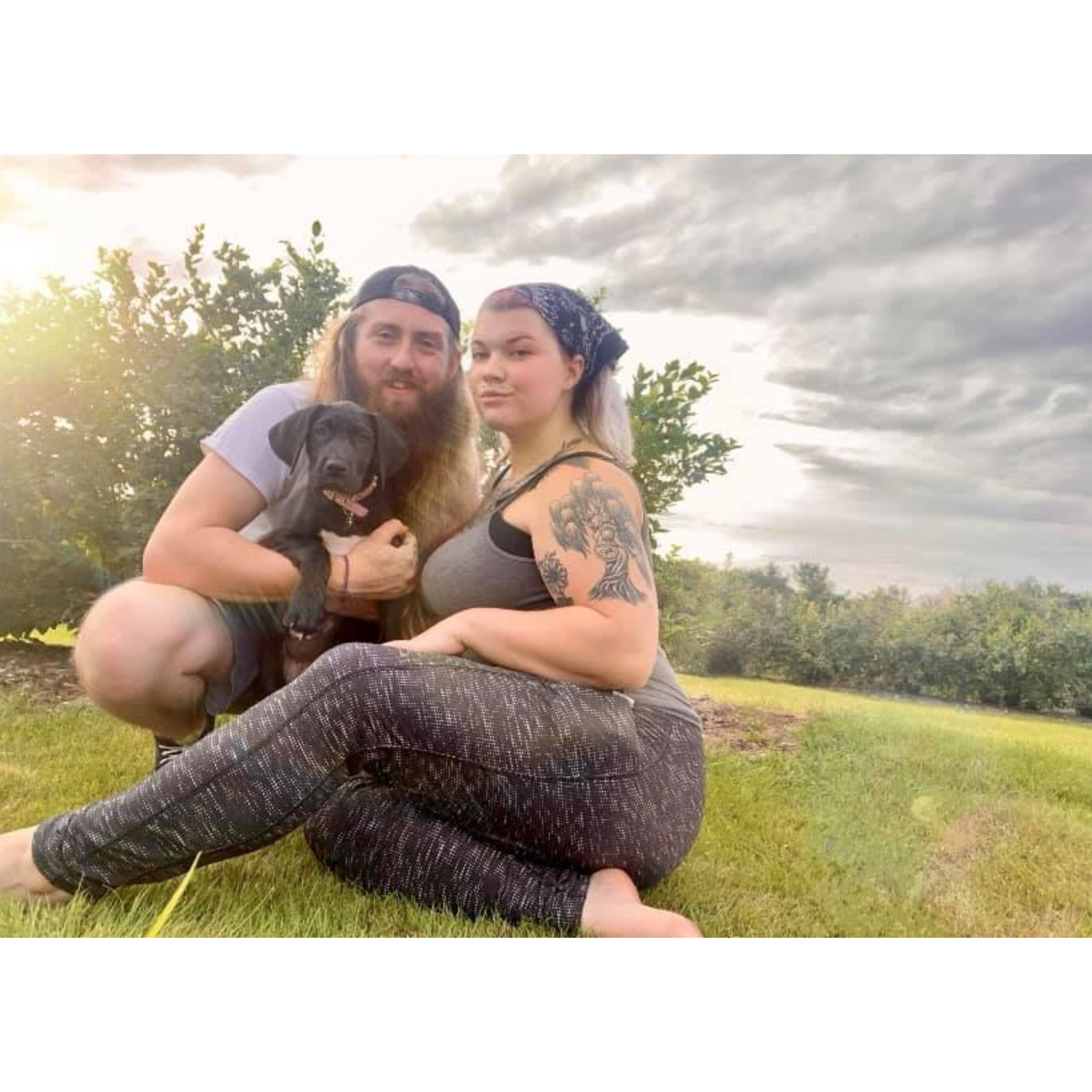 A photo of us at the Red Apple Farm shortly after we got our first pet together ( Medusa Mae)