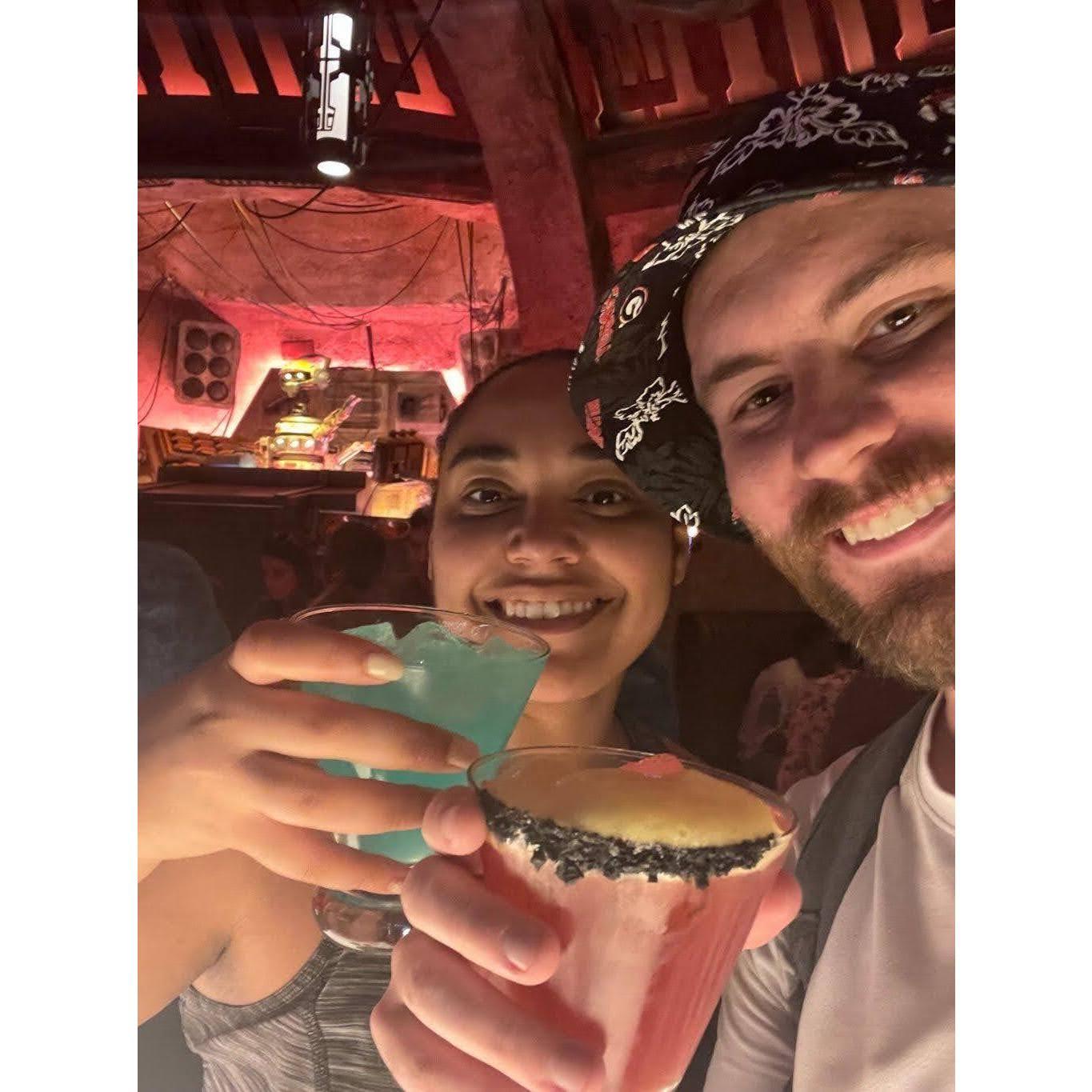 At Oga's Cantina in DisneyWorld! During this trip, Justin asked Brittany's dad for his blessing to marry his daughter (which likely explains why he is wearing a GA Bulldogs bucket hat...) - 06.26.23
