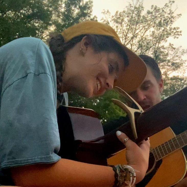 Alex teaching me guitar