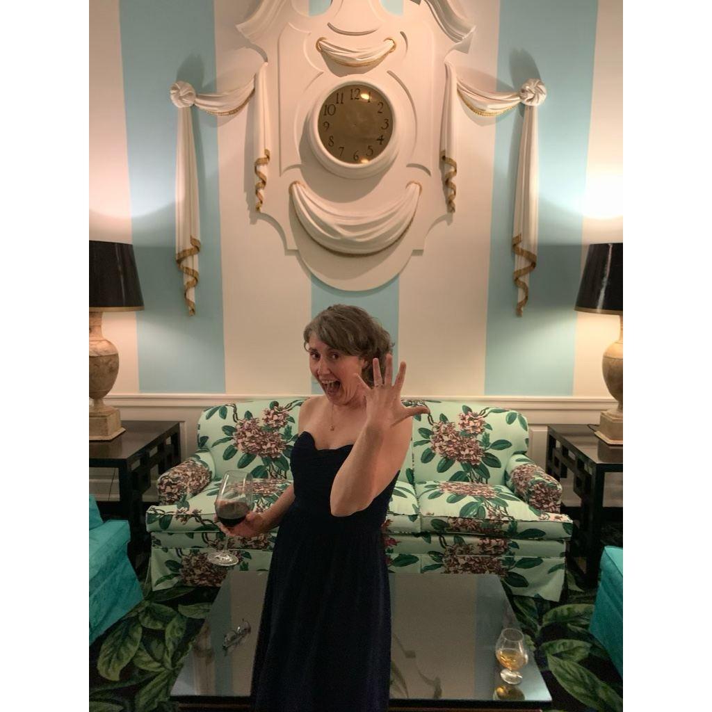 Engaged! In front of the "timeless clock" -- there are no hands on it.