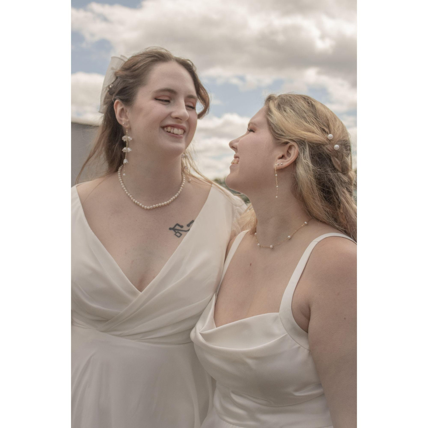 Tabitha and Lillian sharing a loving look before the tractor picked them up for the ceremony