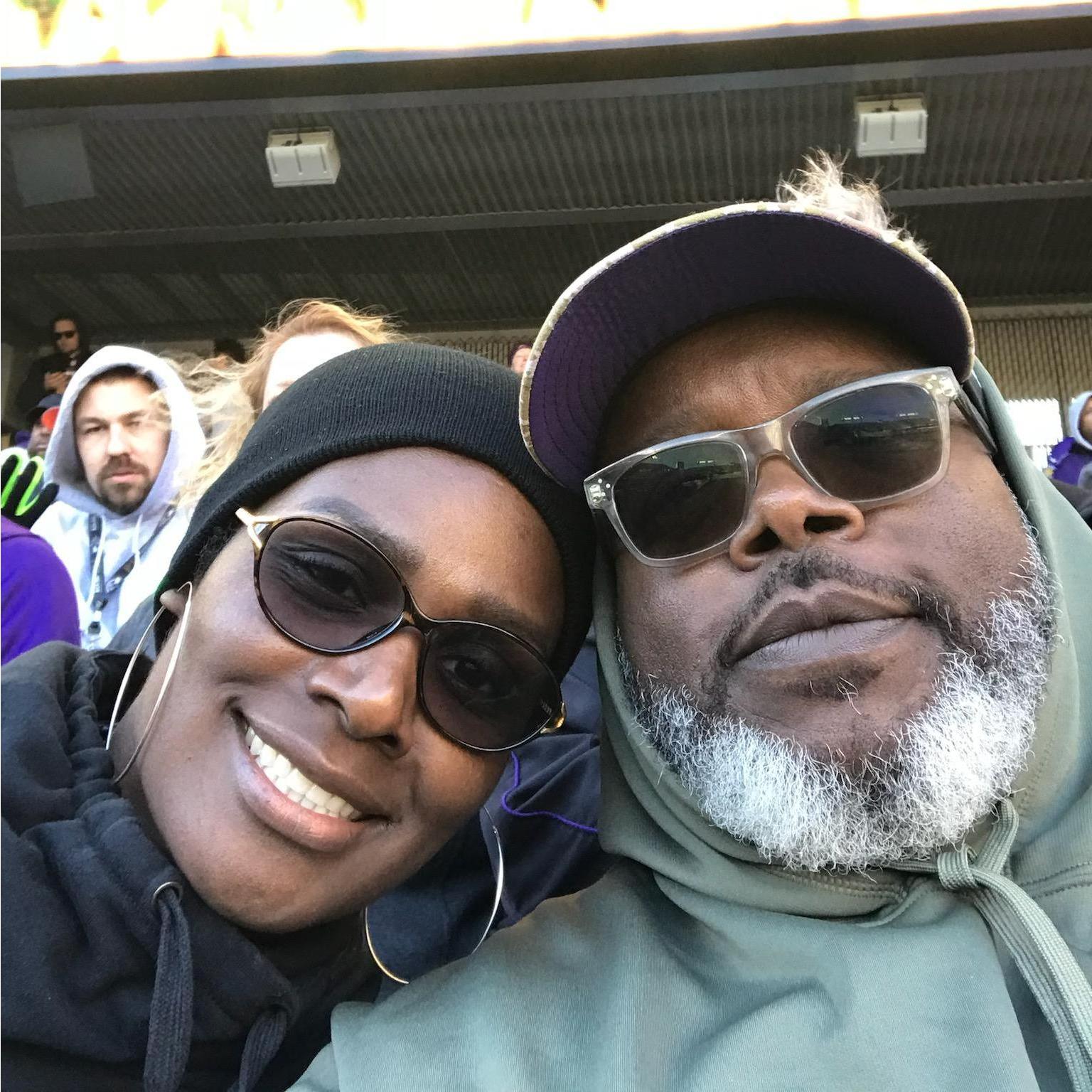 Trying to keep warm at my first Raven's game. I think we won. LOL!