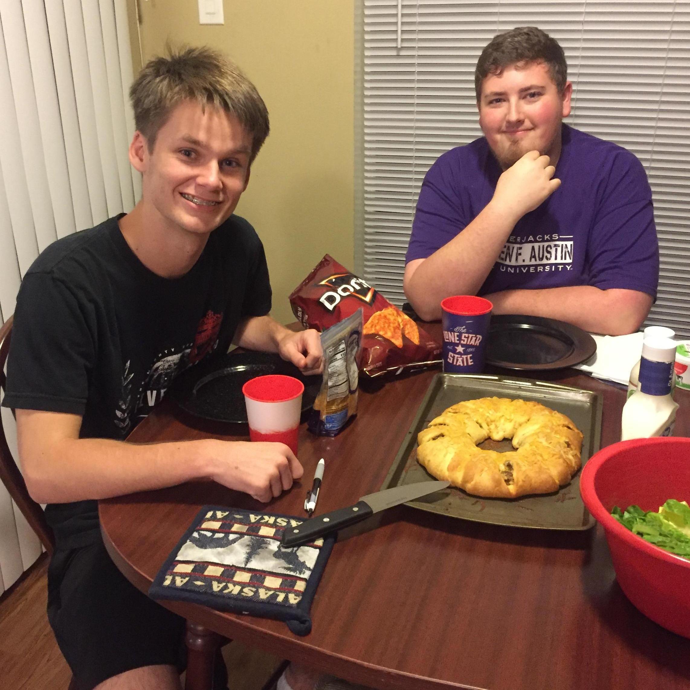 July 2018: Christian, Connor, and the delicious taco ring we made together. Good times!