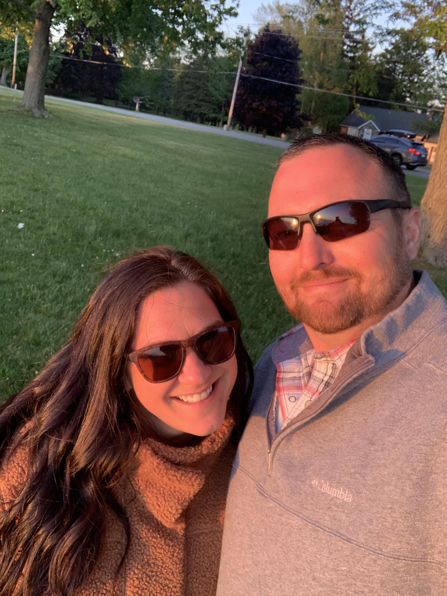 May 2021: Watching sunset in Michigan, right before Fred proposed. It was an unseasonably cold day in May!