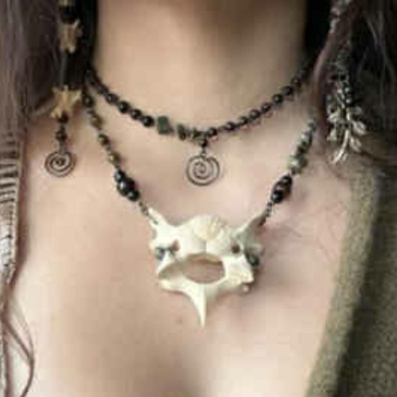 Bone jewelry, wire, bead & stone jewelry are very appropriate.