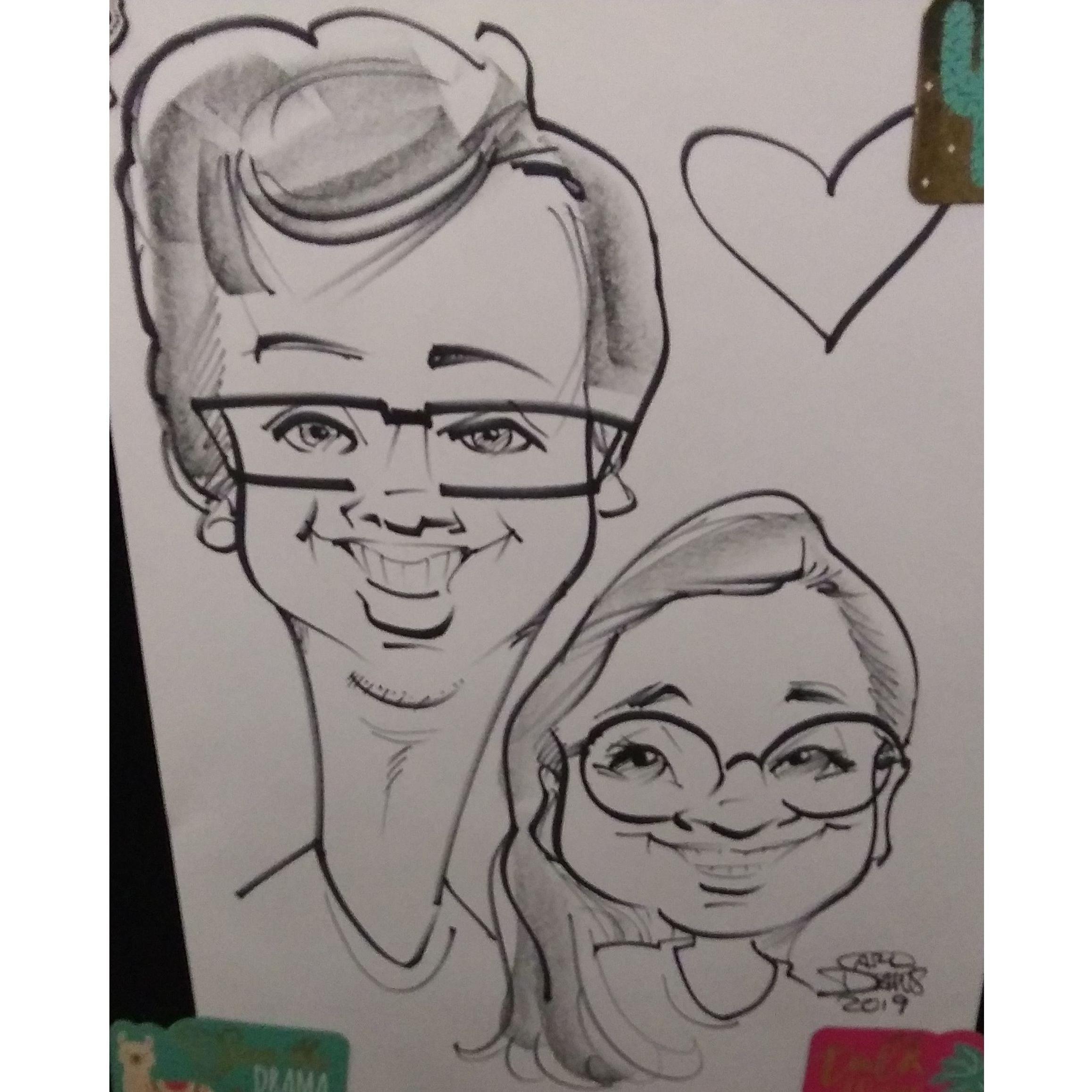 A caricature we had done at a school fair. There were carnival games, prizes, and food.