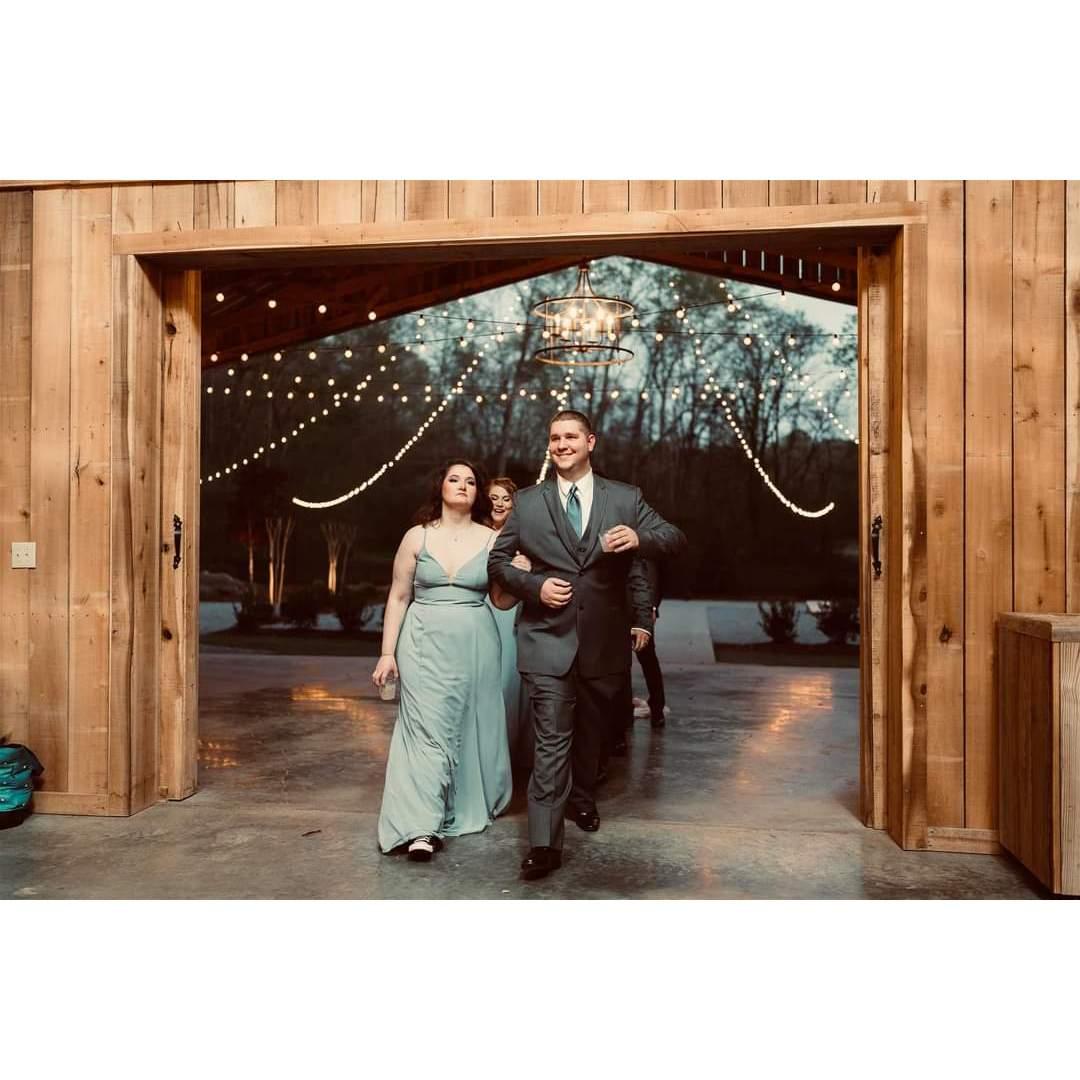 Jess & Ian walking into Ashley & Josh's wedding