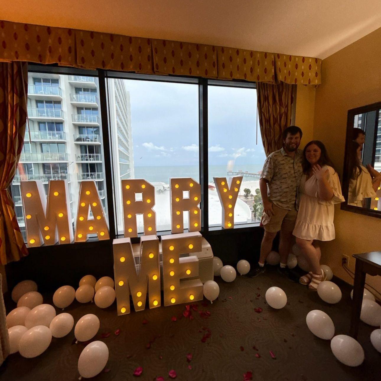 One of our engagement photos in our gorgeous hotel room at clear water beach!