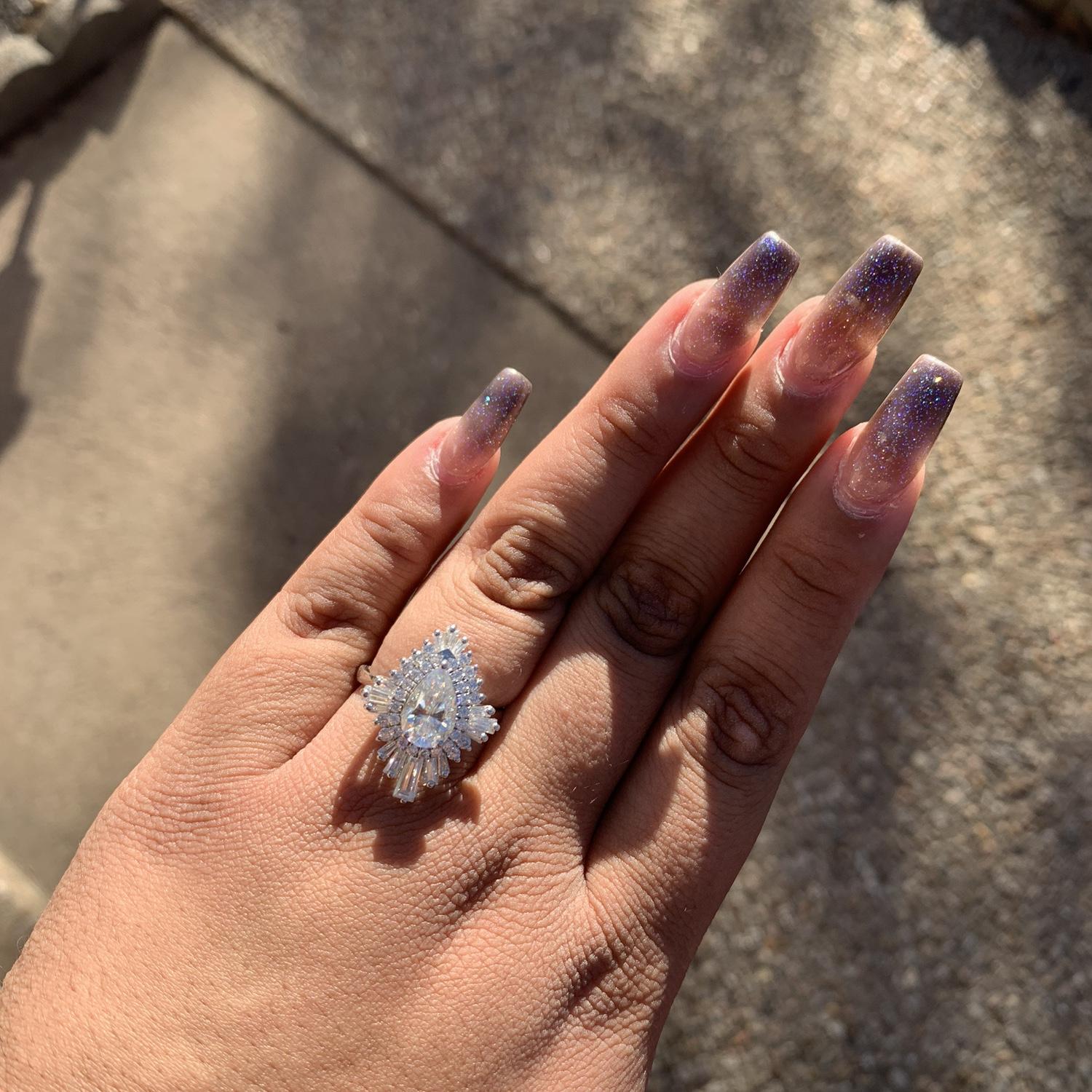 PLEASE IGNORE THE NAILS, but this was the first picture Martha took of her engagement ring shortly after getting engaged in December of 2024.