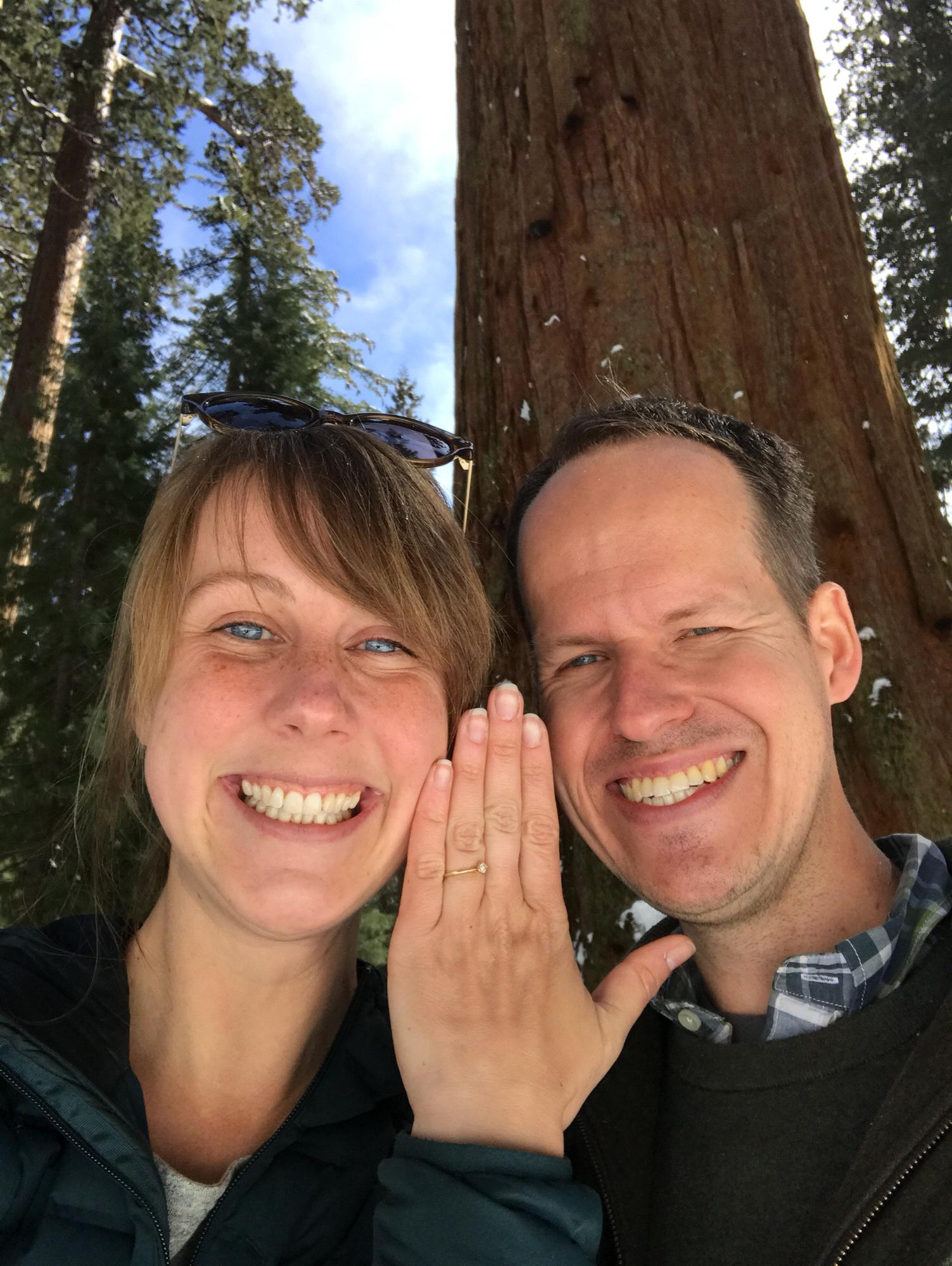 Excitement in front of a big tree!