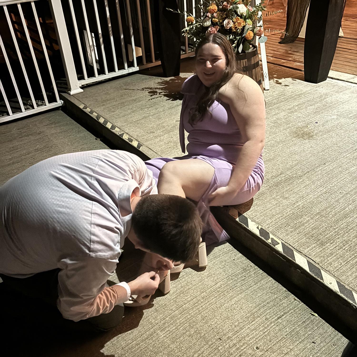 Knight in shining Armor putting on Liz’s Shoe