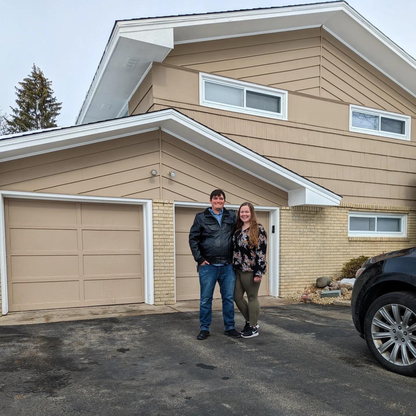 Tom and Tori outside of their home just hours after purchasing it.