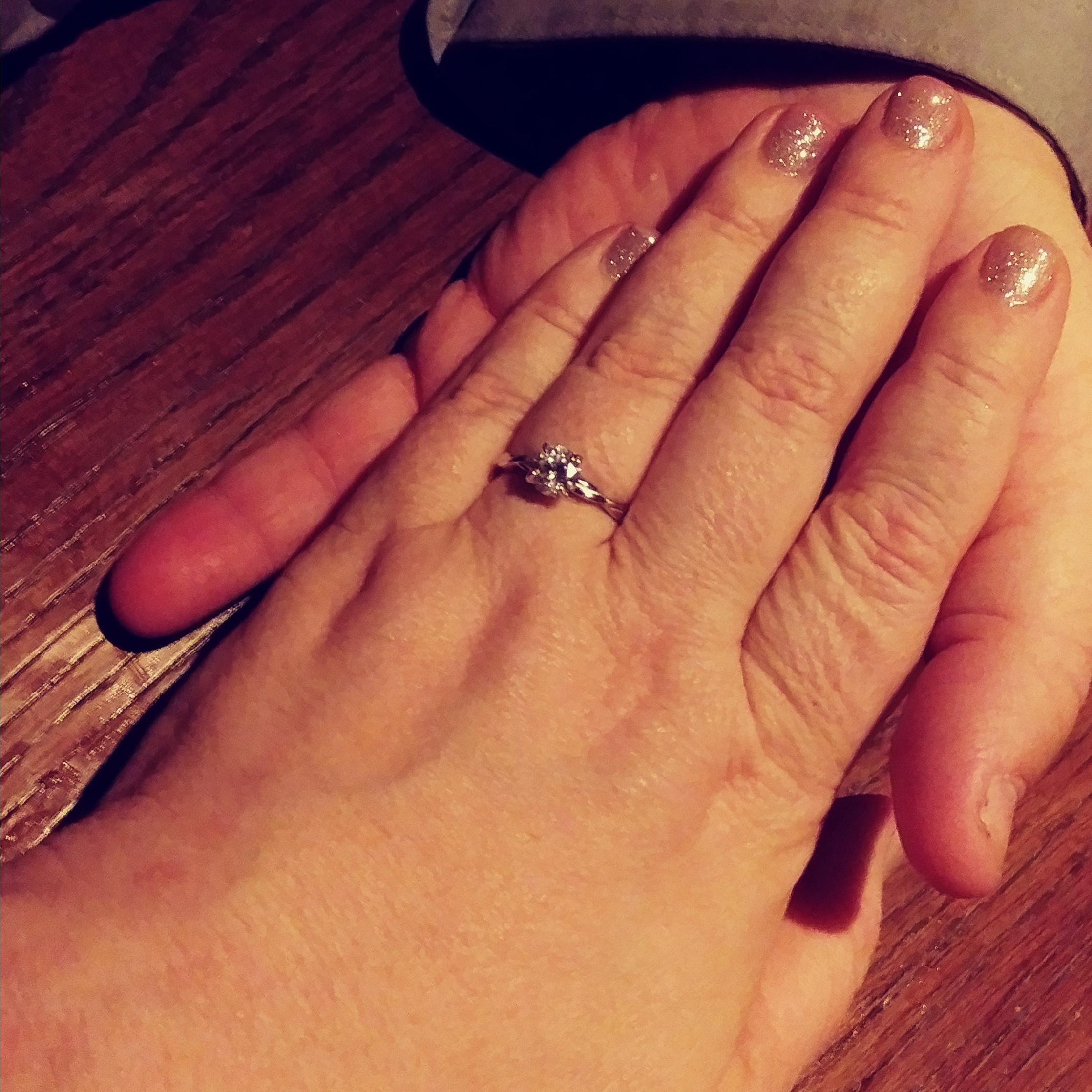 The engagement ring just after he put it on my finger.