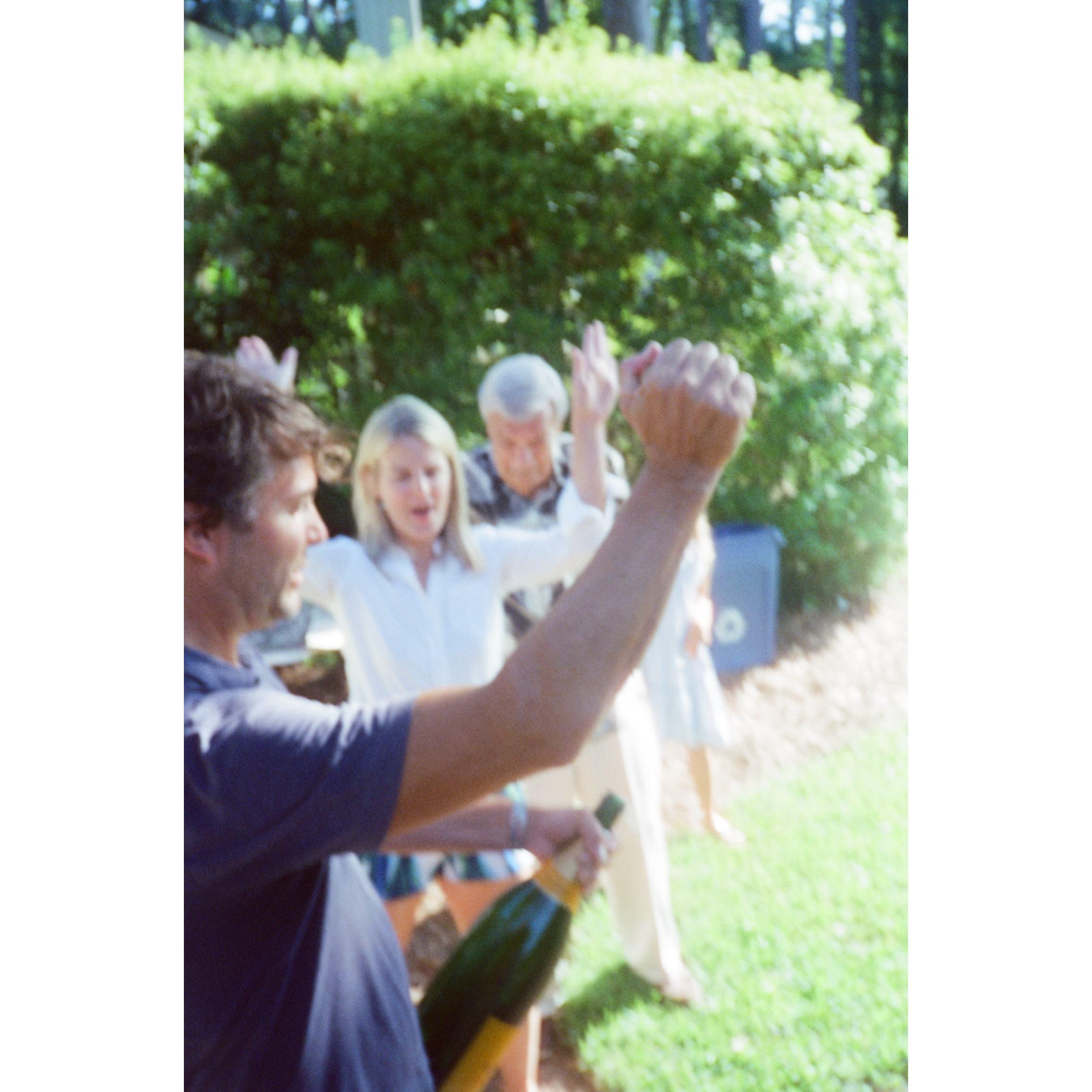 The family popped the cork. Let the celebrations begin!