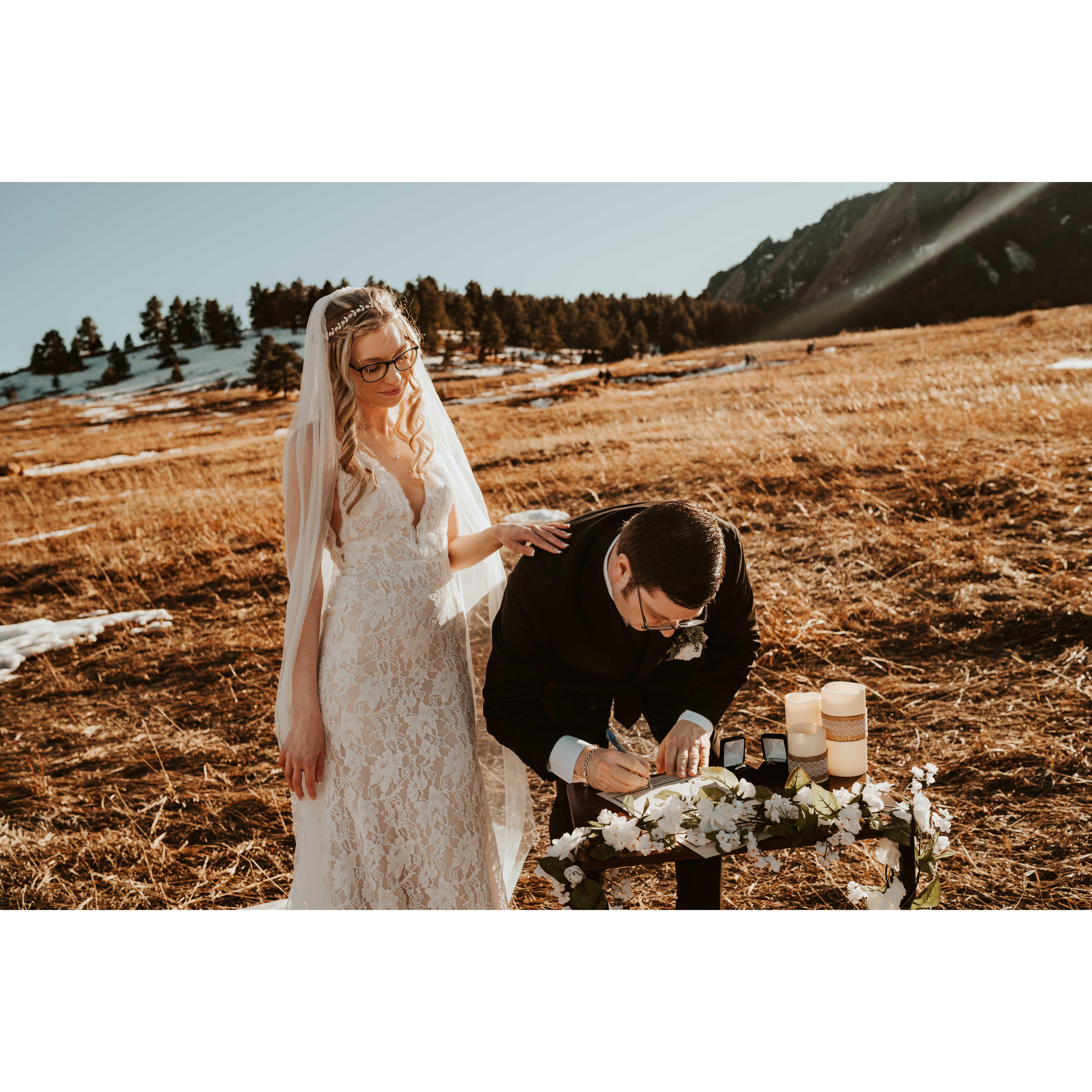 Andy signing our marriage license