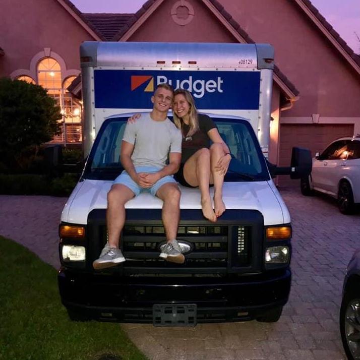 Brady and Lindsey sitting on their moving truck the night before they began their move to Columbus, OH!