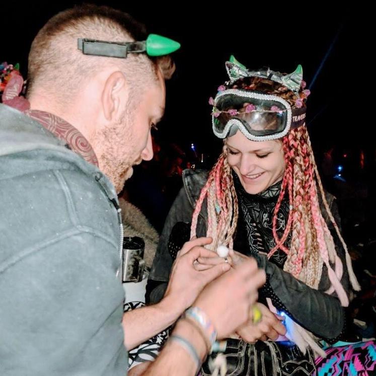 Kellen proposed at Burning Man 2018 with a pink pompom ring!  The final engagement ring is set with a diamond which was originally a gift from Sarah's Papa (Ade) to her Nana (Irma)