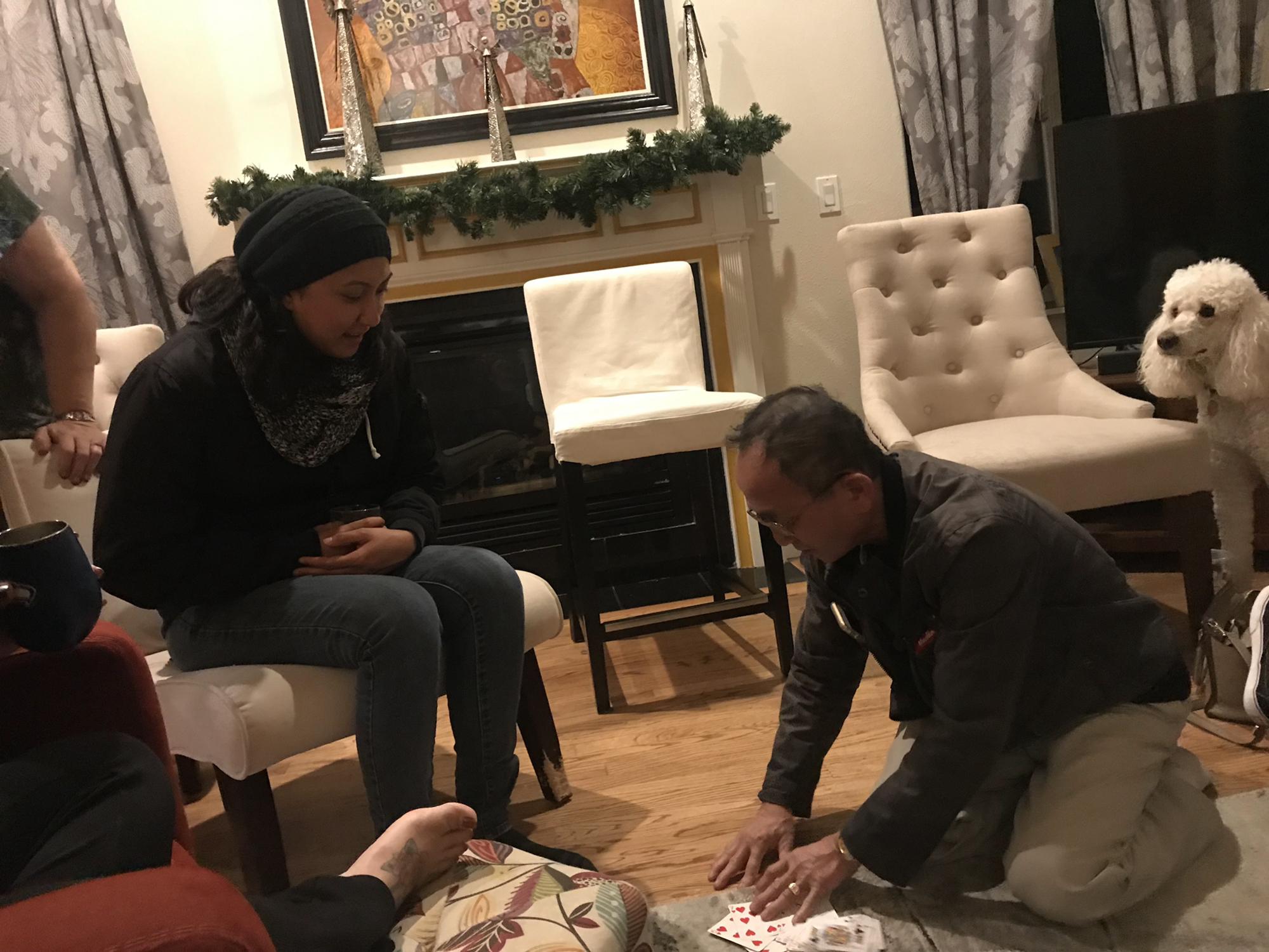 Janelle meets Somaly’s Dad for the first time- he shows off his magic tricks to welcome her to the family.