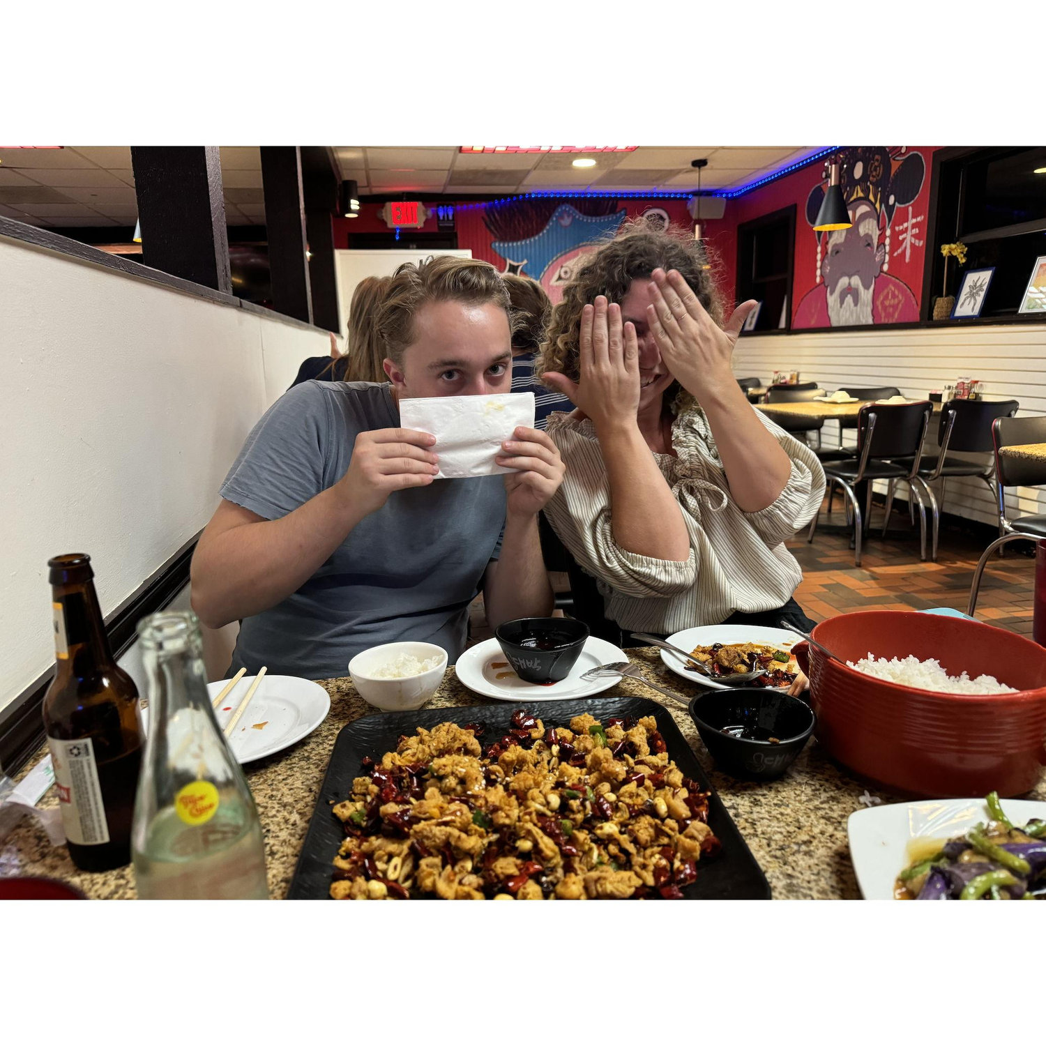 At our favorite Chinese restaurant in Austin, eating our favorite dish called "Hide and Seek chicken" and acting it out haha