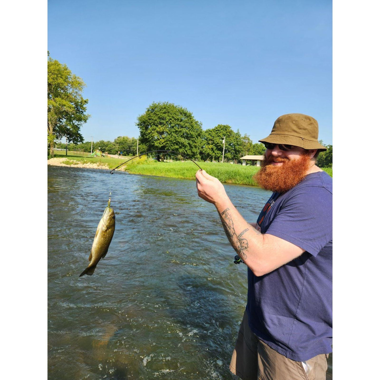 Derek catching his first fish, and first time fishing