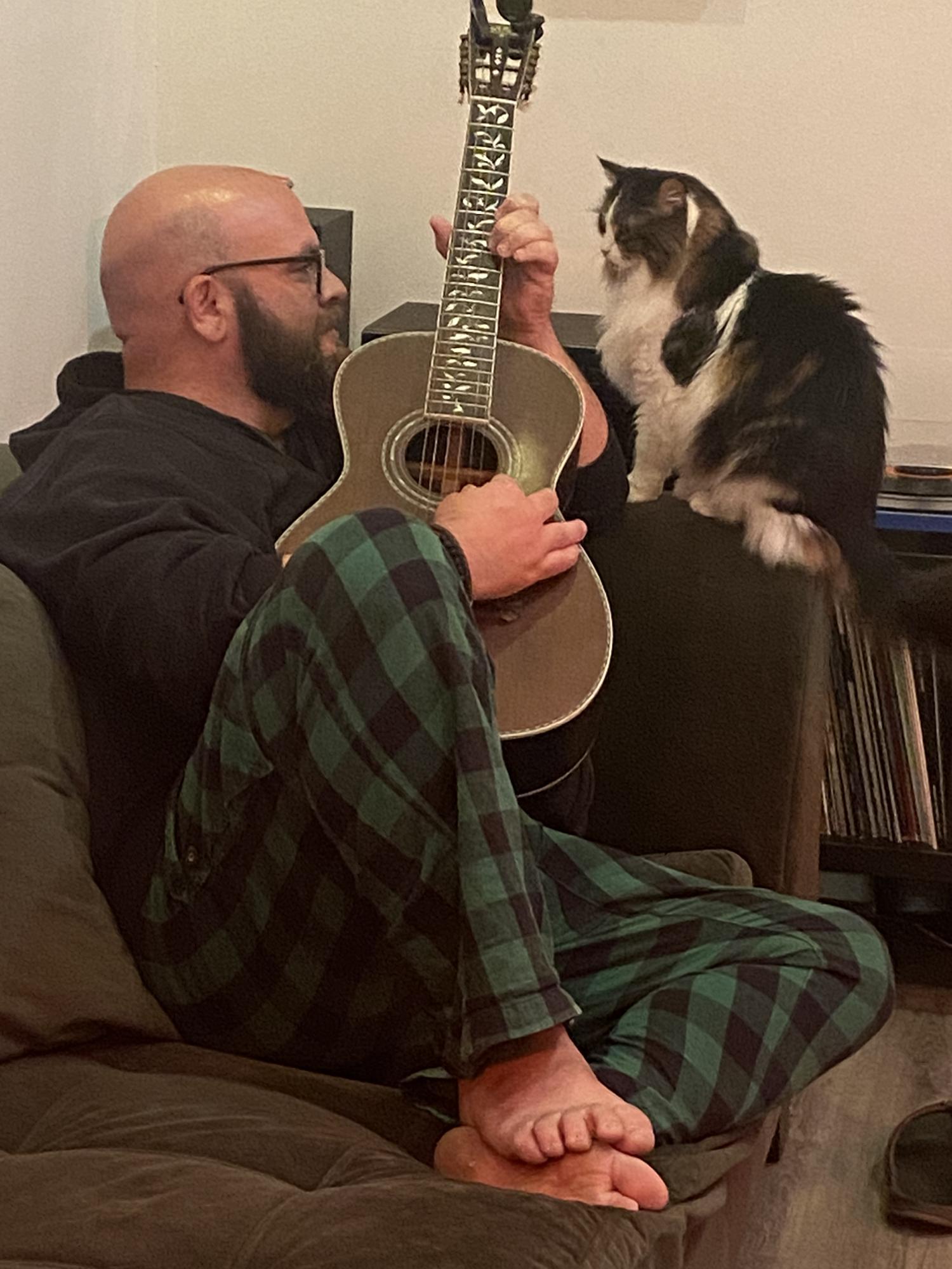 Ed serenading Mildred the Cat on a Washburn parlour guitar