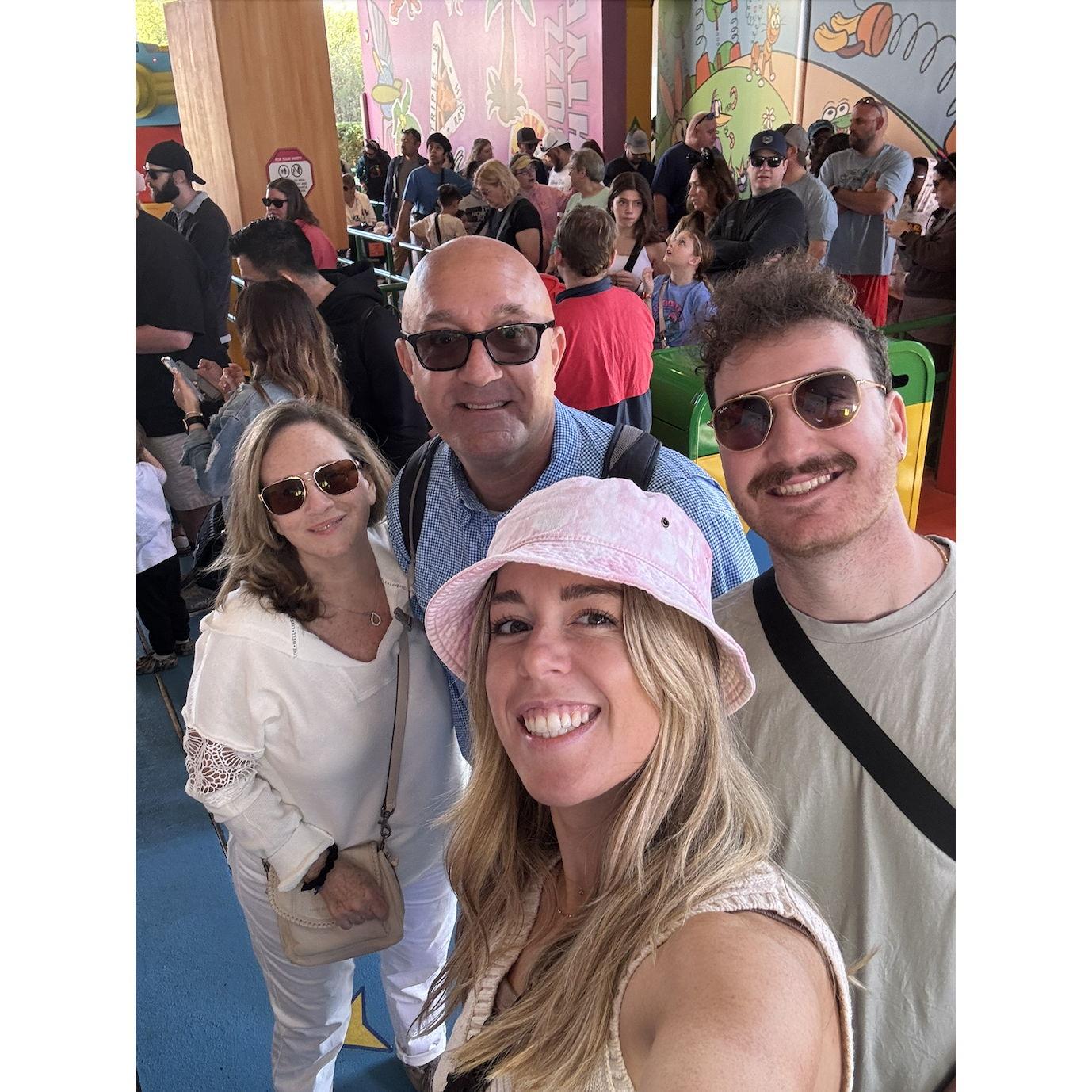 At our favorite place on Earth (Disney) with some absolute legends, Aunt Lauranne and Uncle Neil (our officiant).