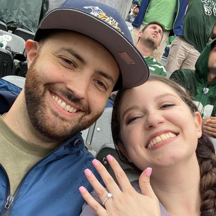 Bryan and Caitlin at a Jets Game with Becca & Jeremy (not pictured) the day after the proposal