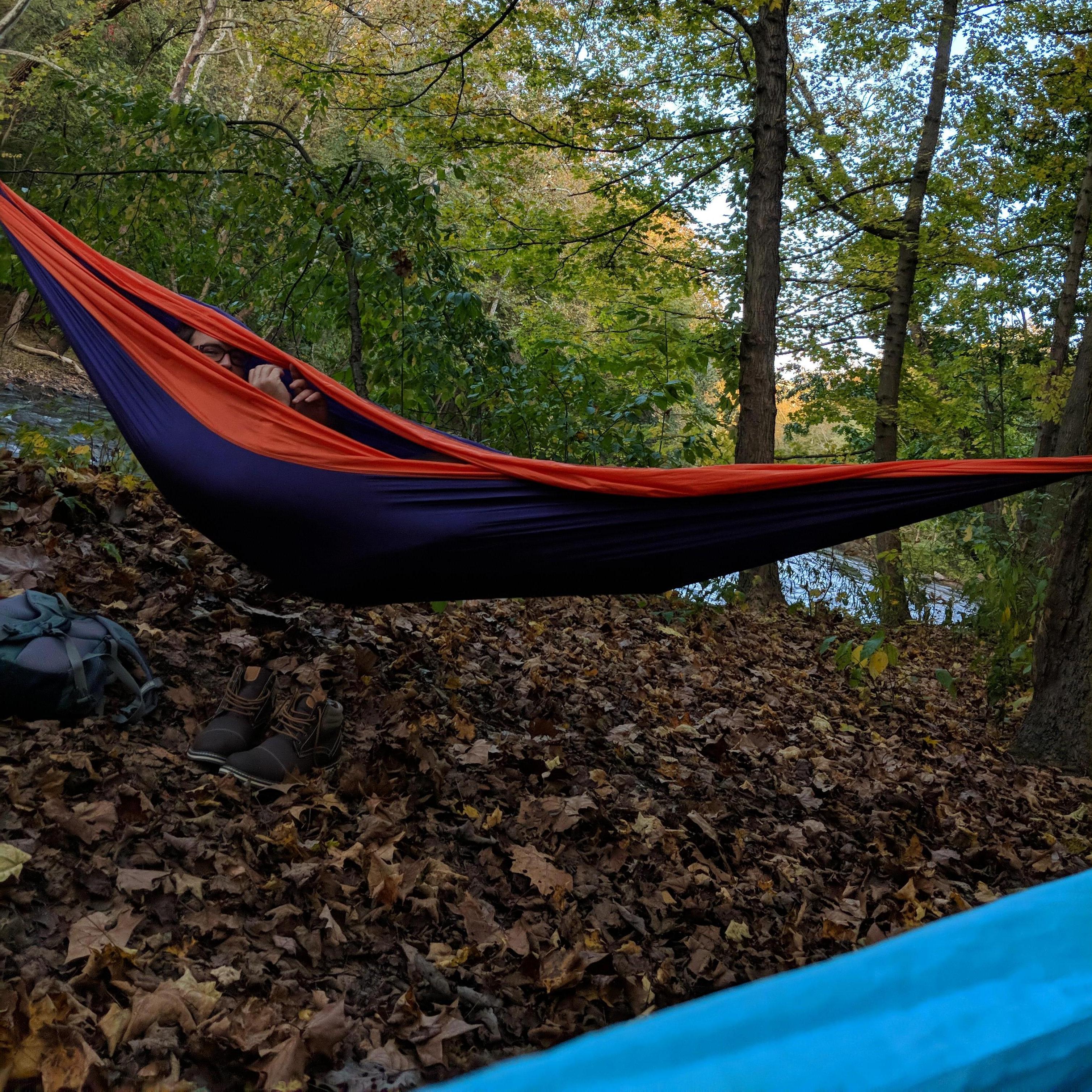 Snapping a clandestine photo of Tory hammocking on our first date where we threw notes back and forth.