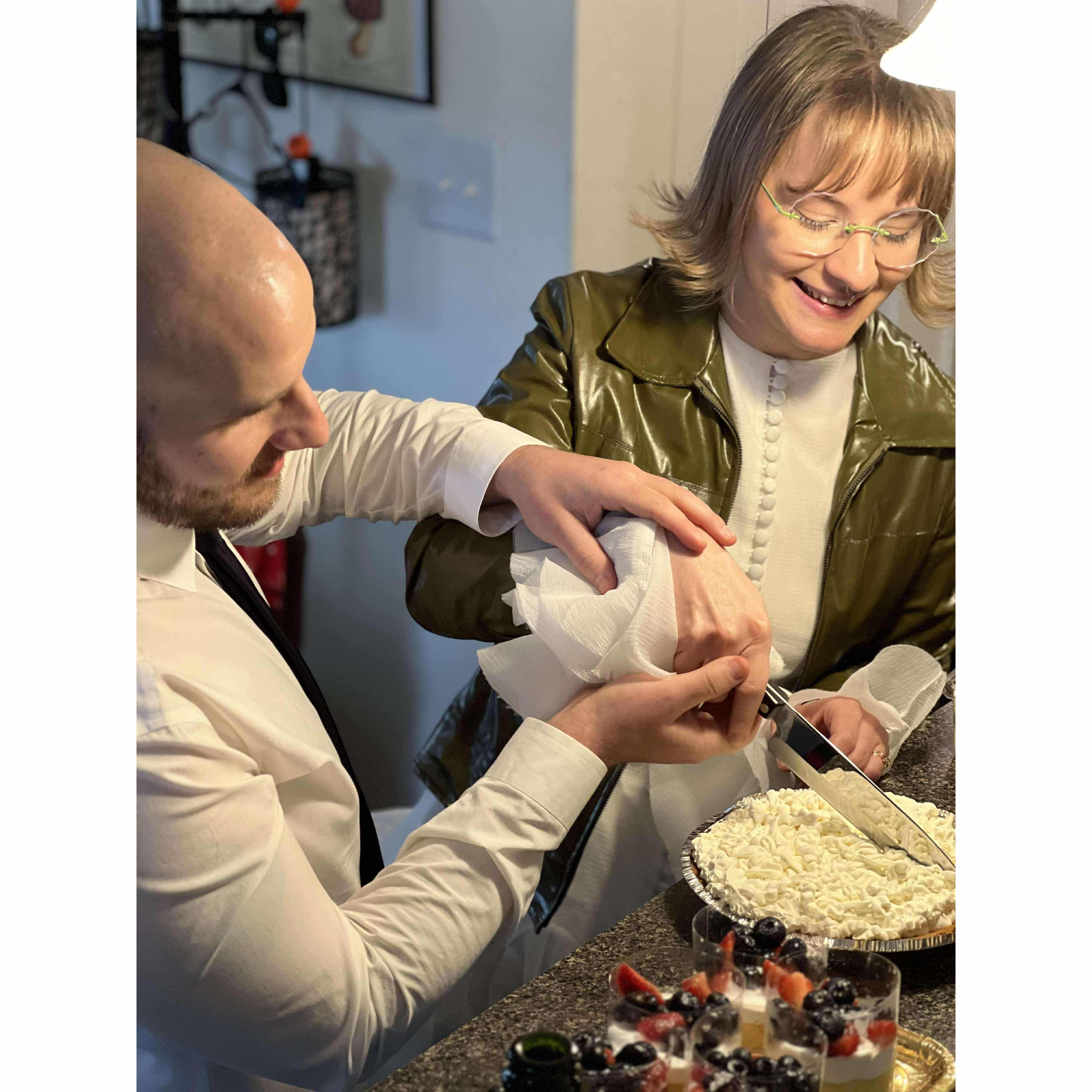 Cutting the Key Lime Pie that I made for our wedding "cake"