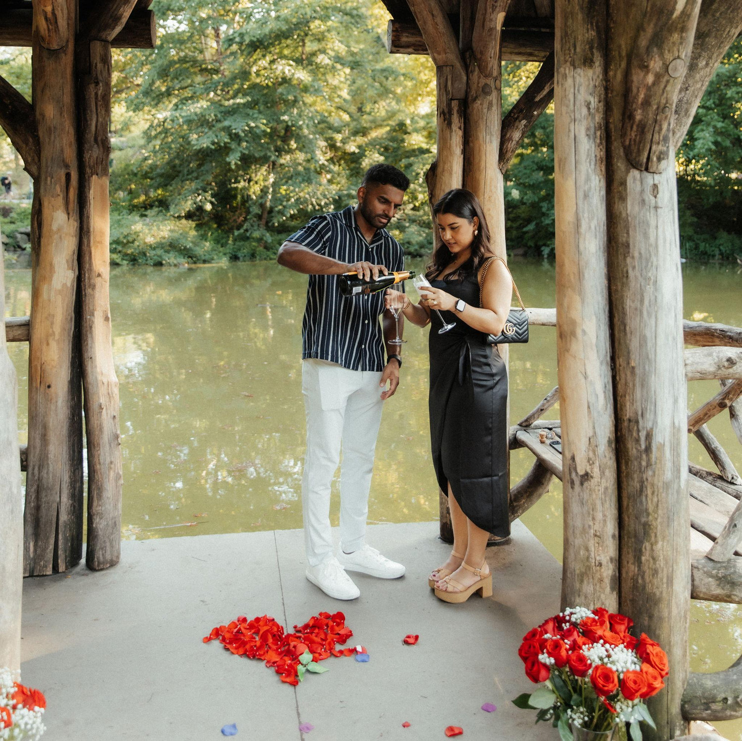 Popping some champagne after she said yes!