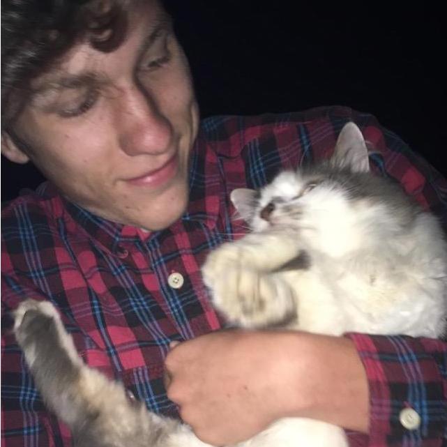 Jeremy with a cat we found on the street on the night he modeled for Malone- their first excuse to hang out- Sep 2016