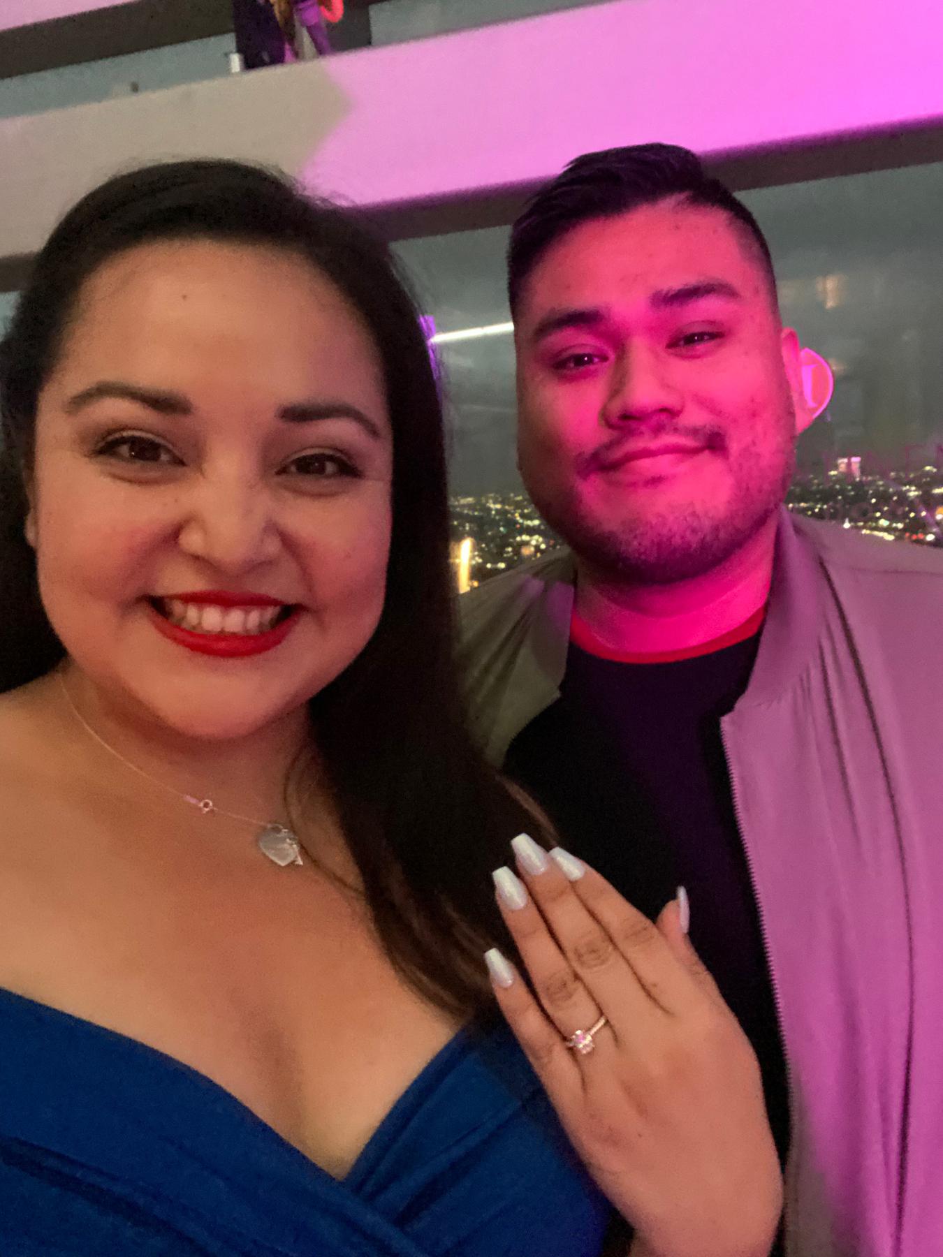 Oliver proposed on their three year anniversary at Spire 73 Restaurant