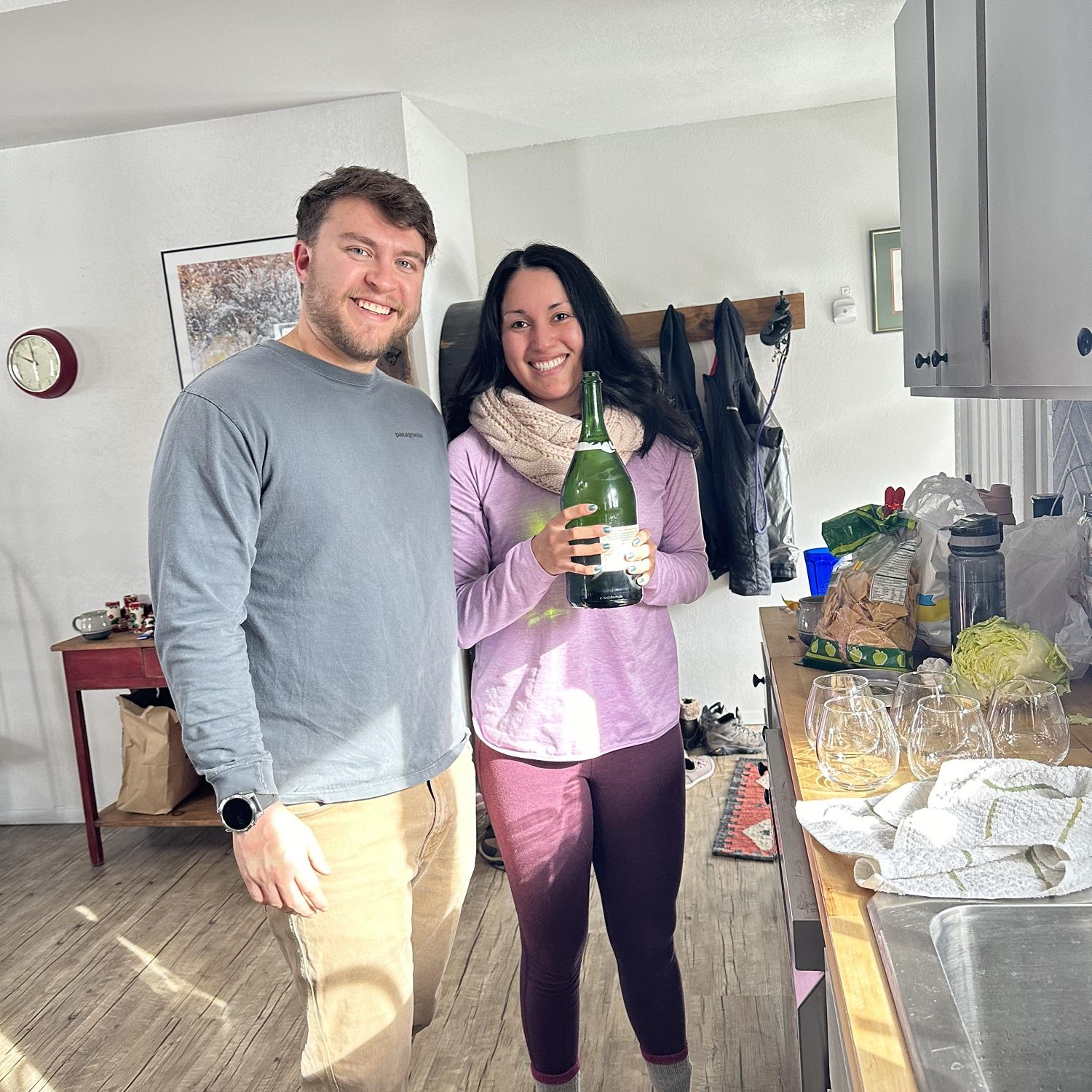 Celebrating our proposal with champagne!