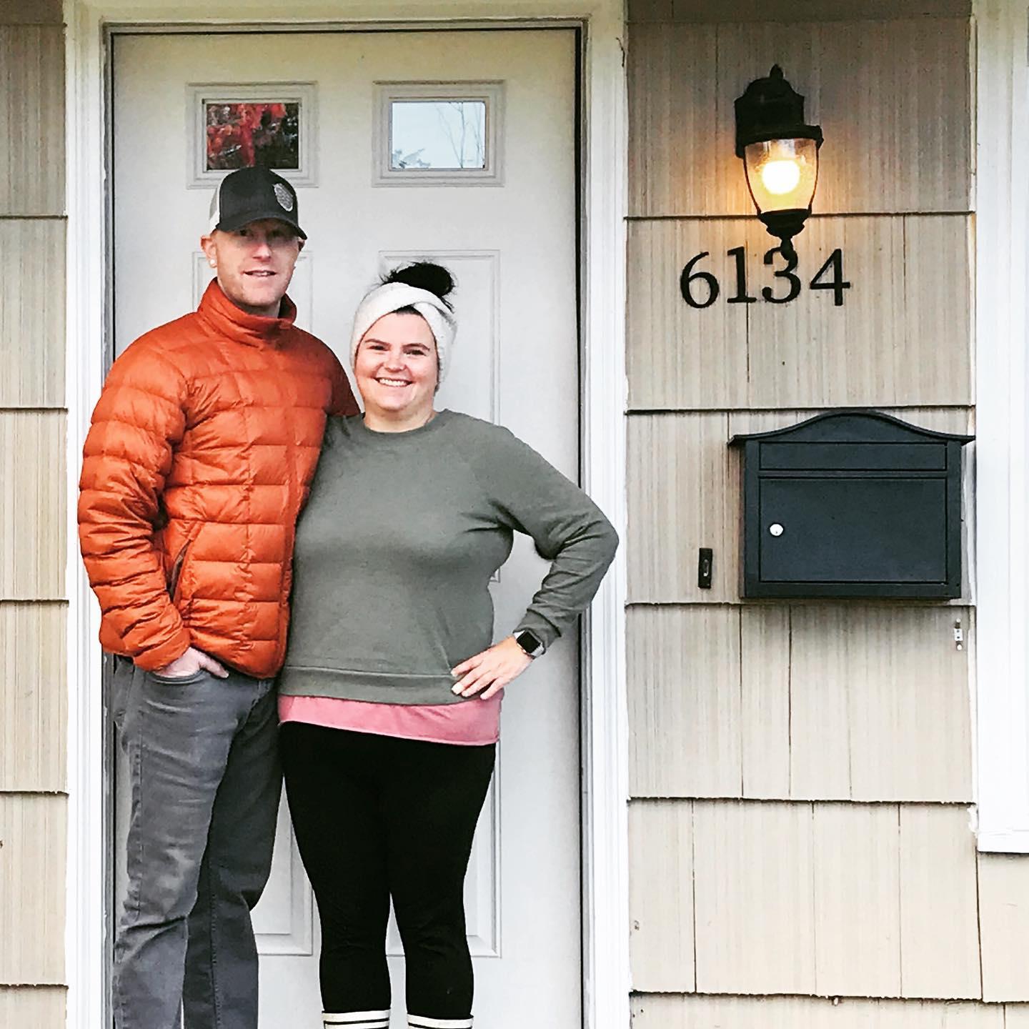 Our first photo in front of our newly purchased home, 2020!
