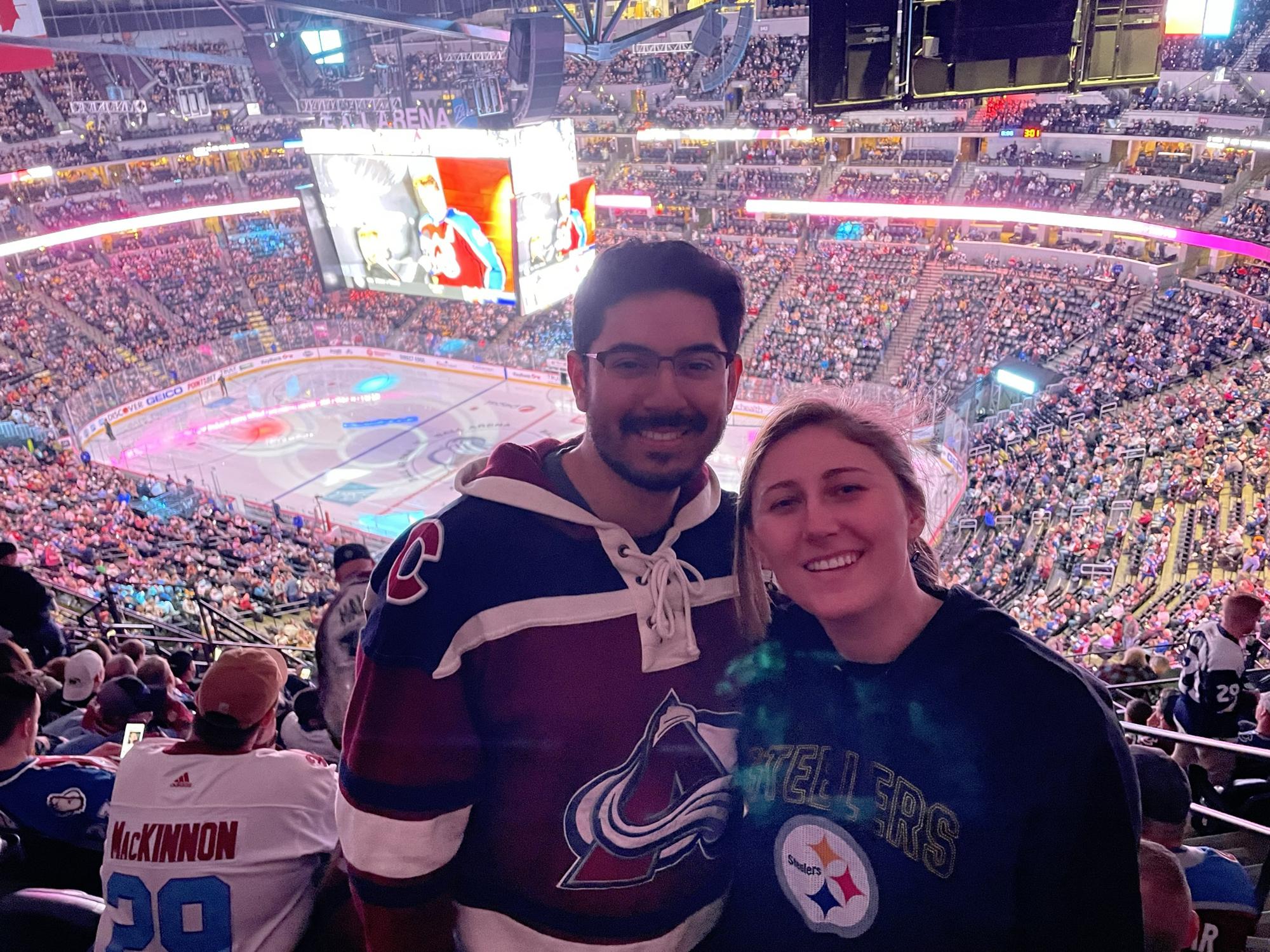 Esteban and Mallory at an Avalanche vs Penguins game in Denver