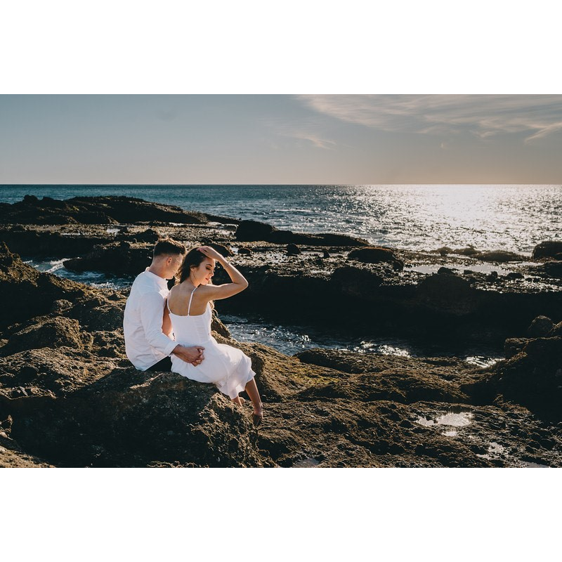 One of our engagement photos. We look calm but really we were scared of the giant waves that were breaking in between taking photos haha