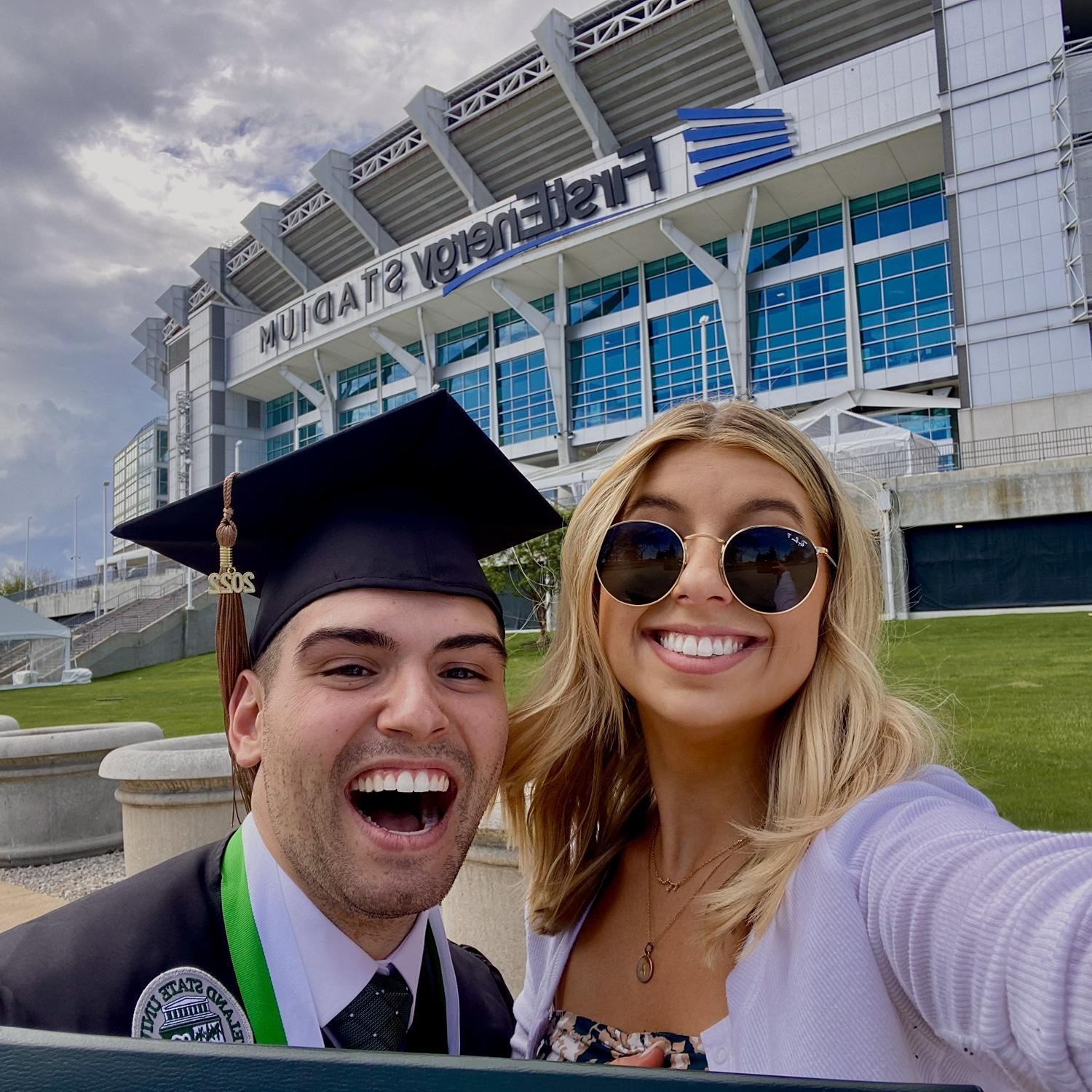 Taking pictures at the Brown's stadium right after Luciano's graduation from CSU.