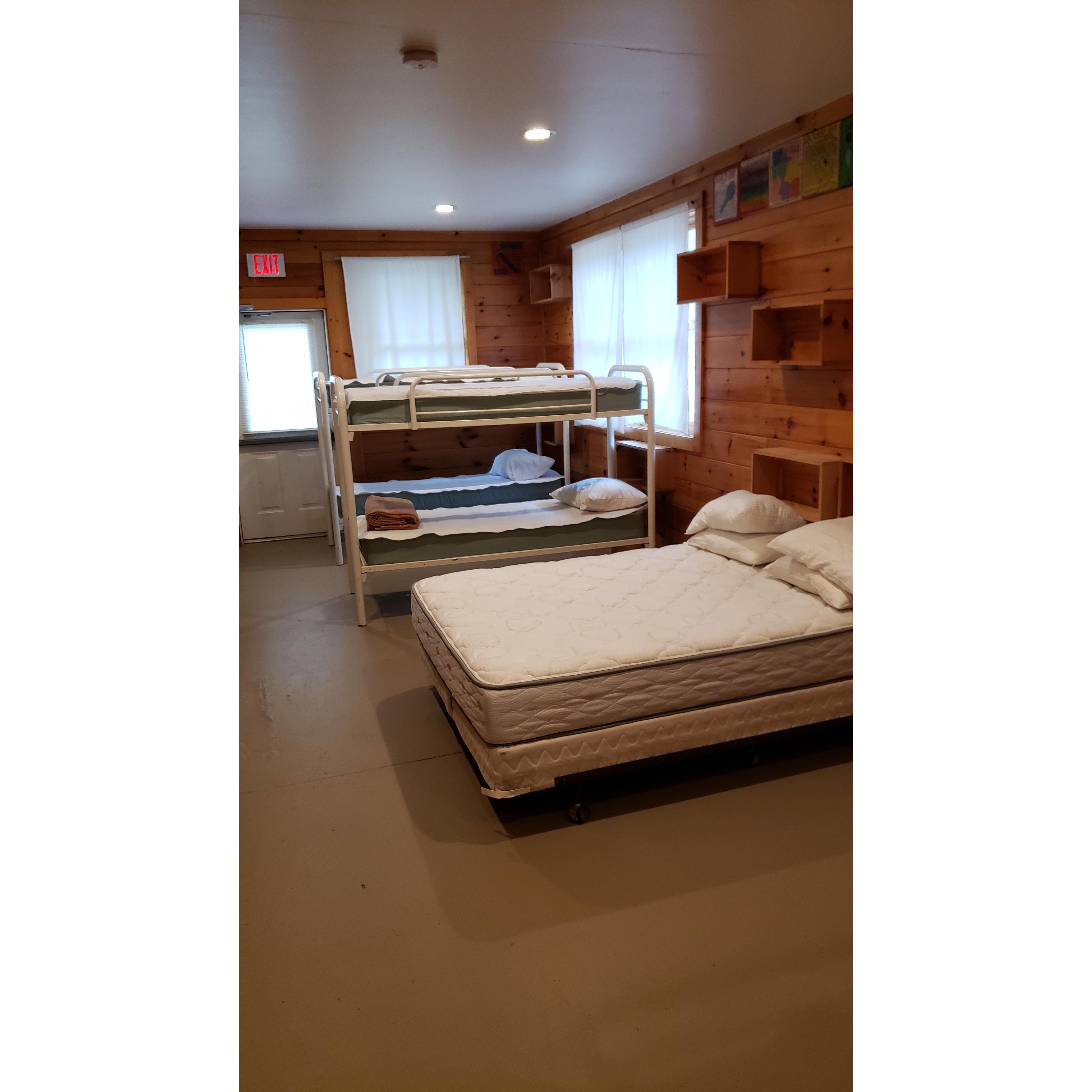 Cabin Style. Bunk beds can be pushed together, and this picture is only half the room.