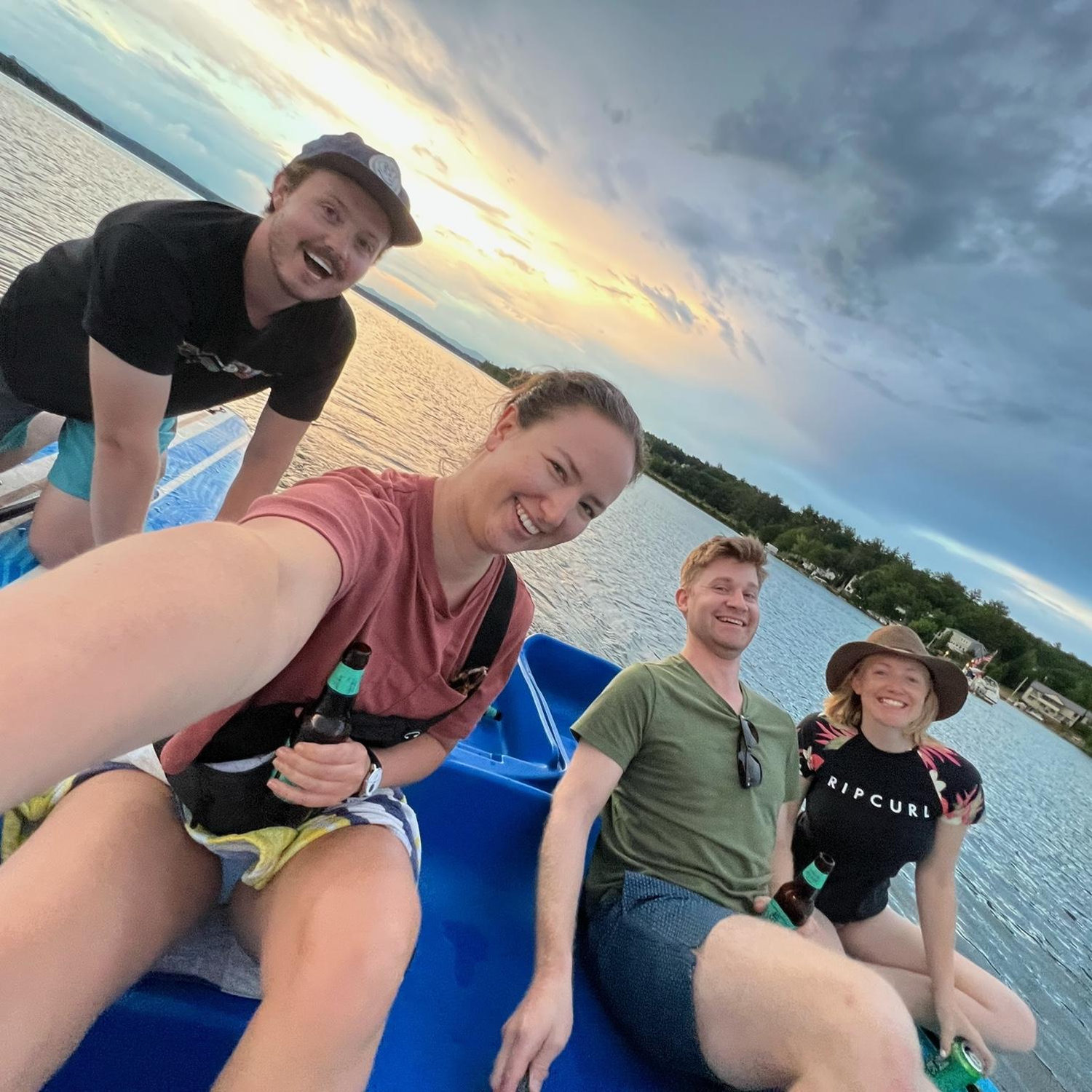Enjoying sunset paddle boat beers with family in New Hampshire, 2022