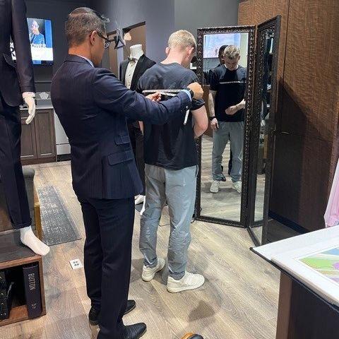 Quinn getting fitted for his suit