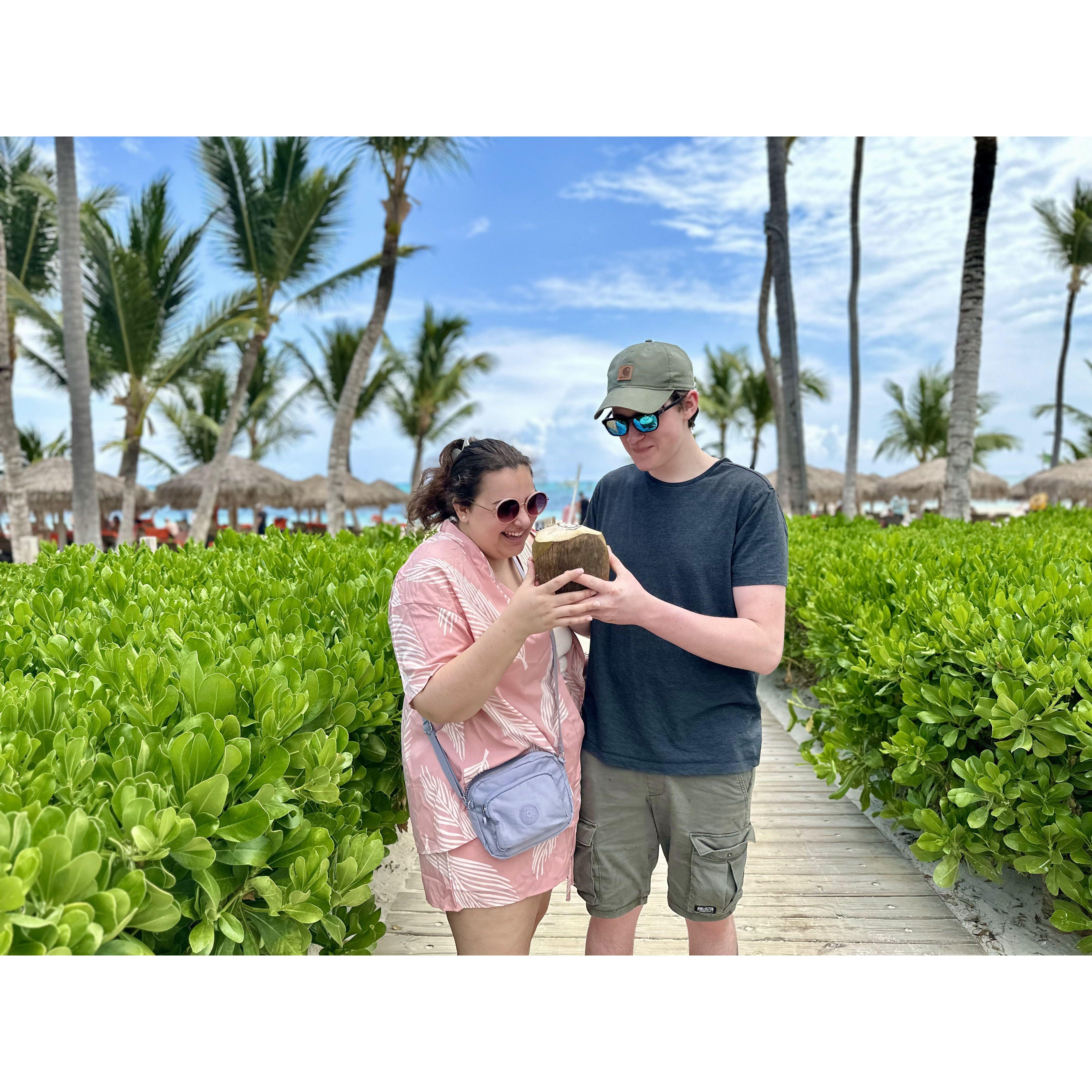 In Punta Cana, drinking from a whole coconut- the best warm water we've ever had