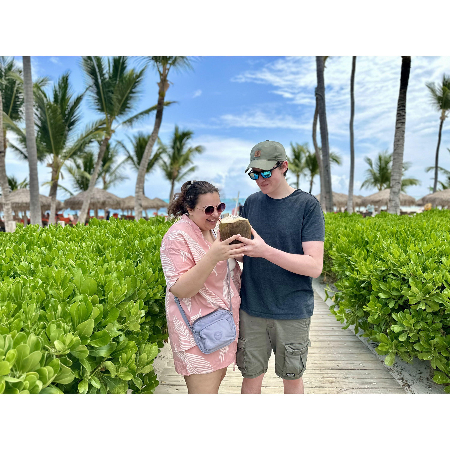 In Punta Cana, drinking from a whole coconut- the best warm water we've ever had