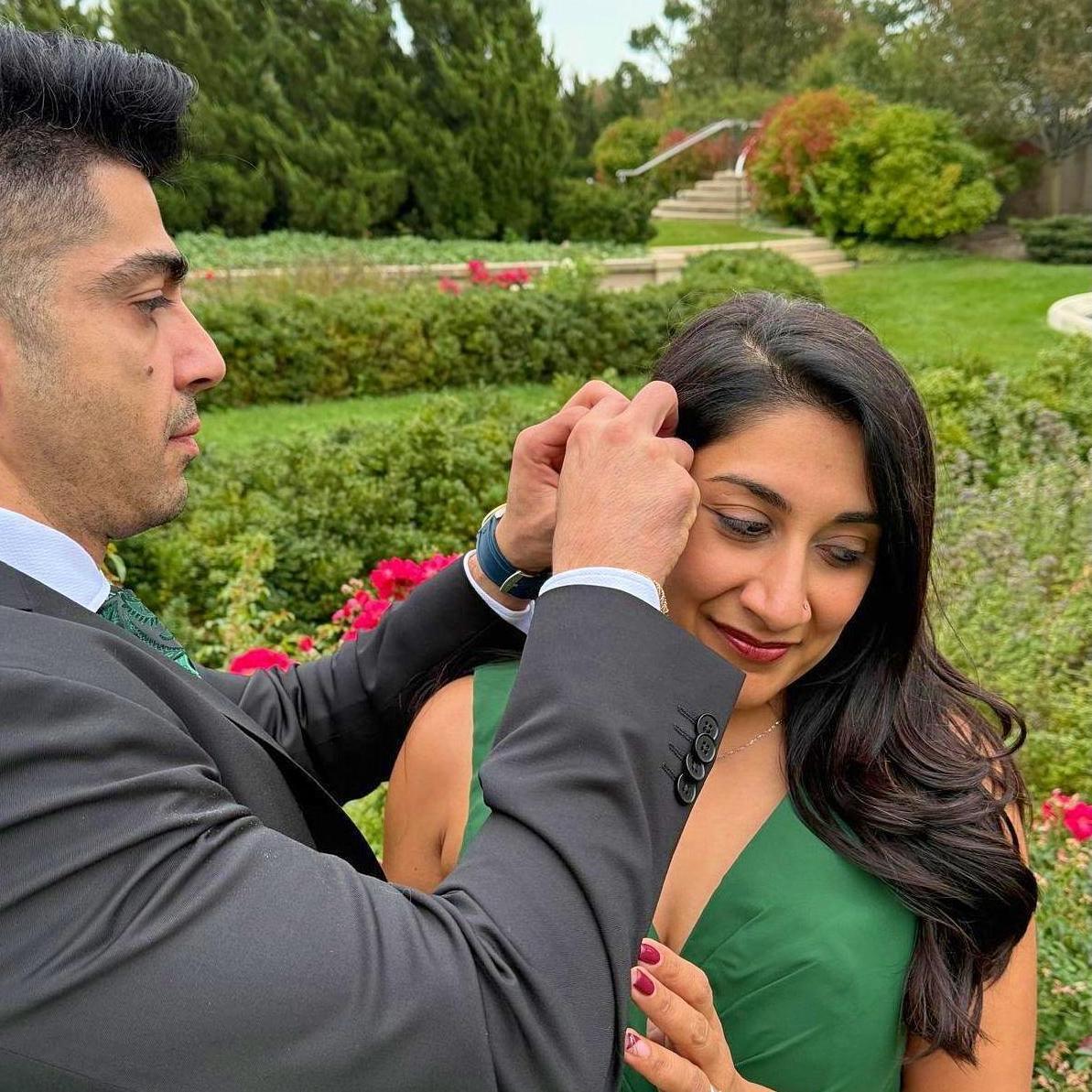 Pinning a flower on a flower...right after Arash told Shivani "we are going to taco bell after this"