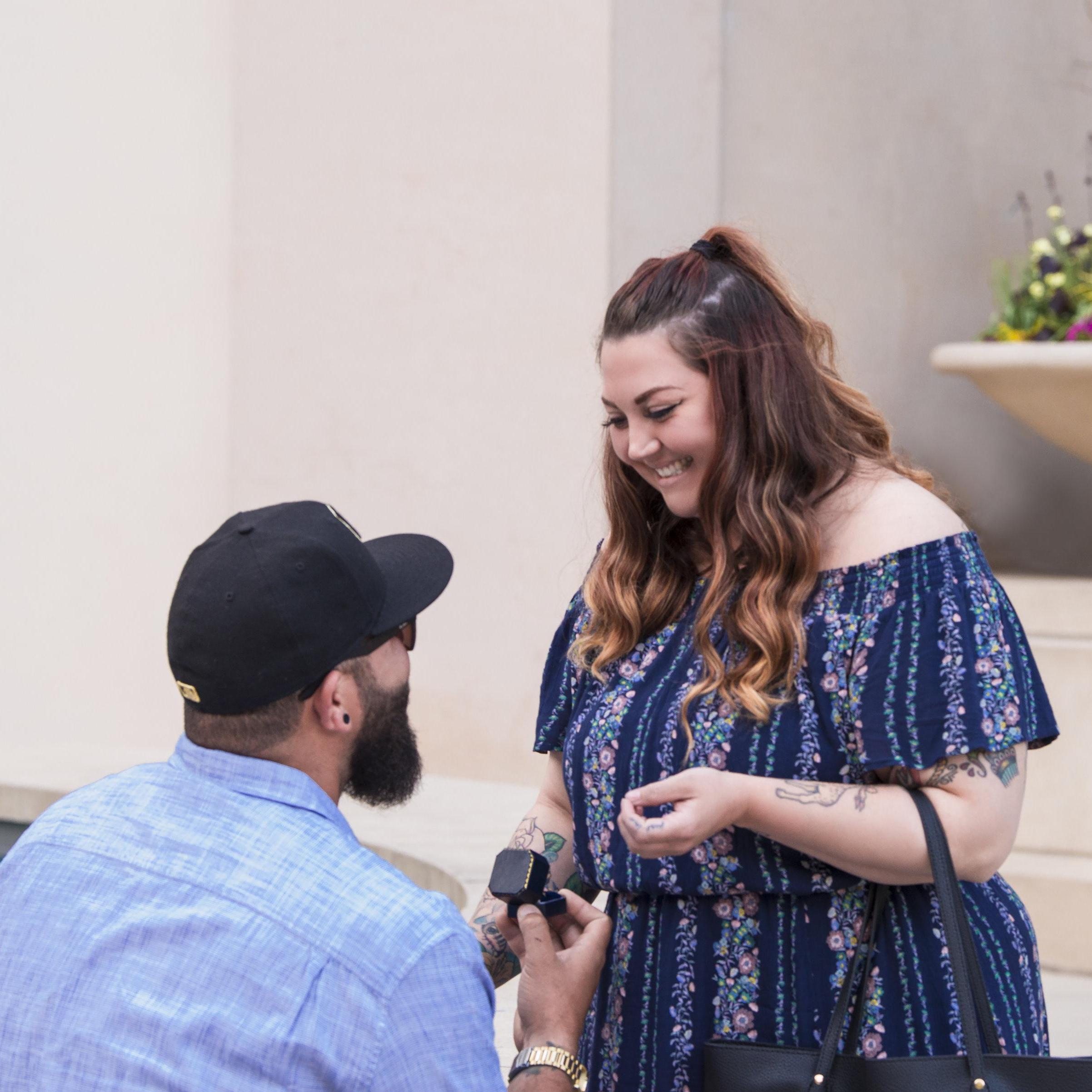 Cody proposed in front of the Millennium Monument fountain, in Chicago IL.